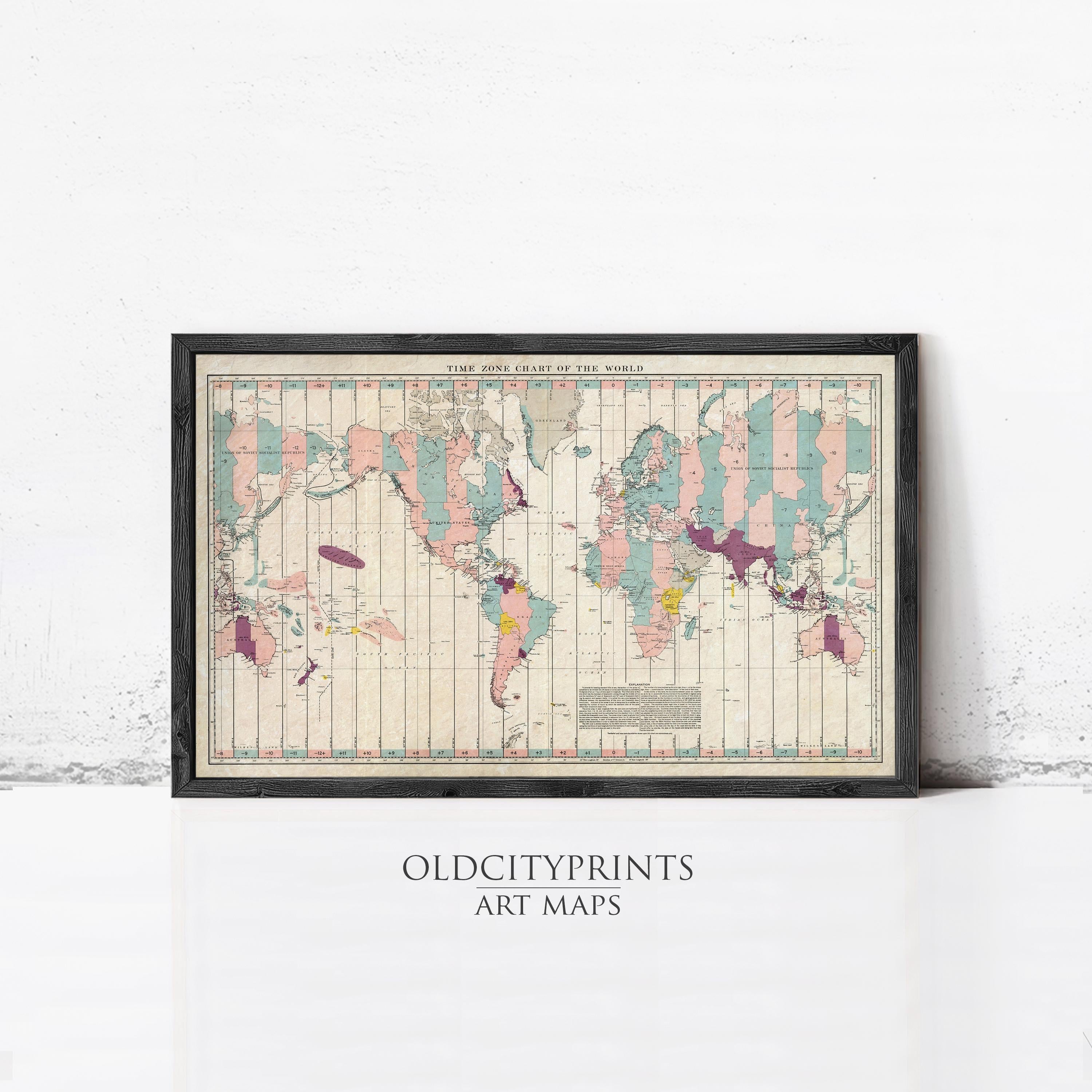 The image is a framed vintage world map with a black border and a light beige background.