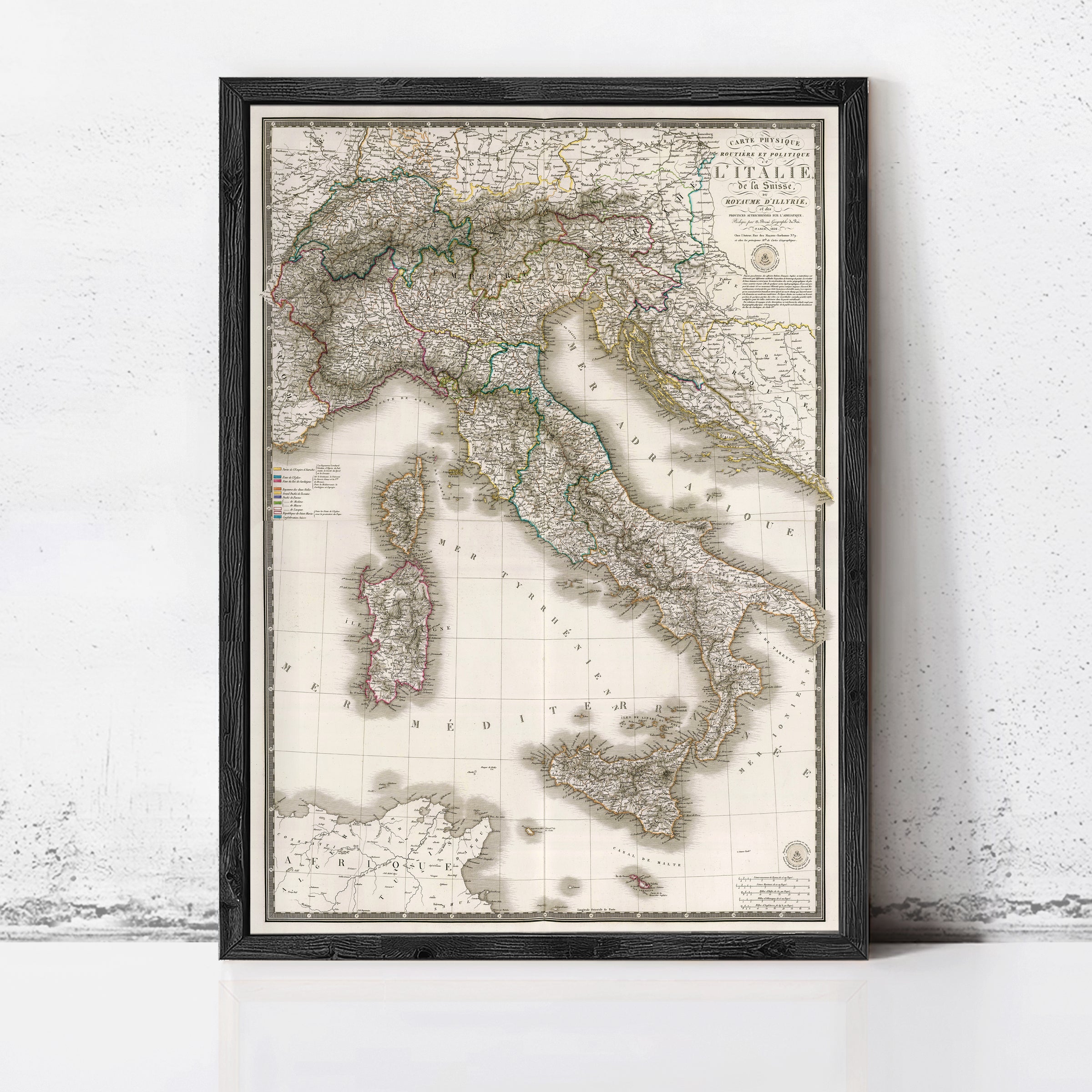 The image is a framed map of Italy, showing the country's geographical layout and surrounding areas.