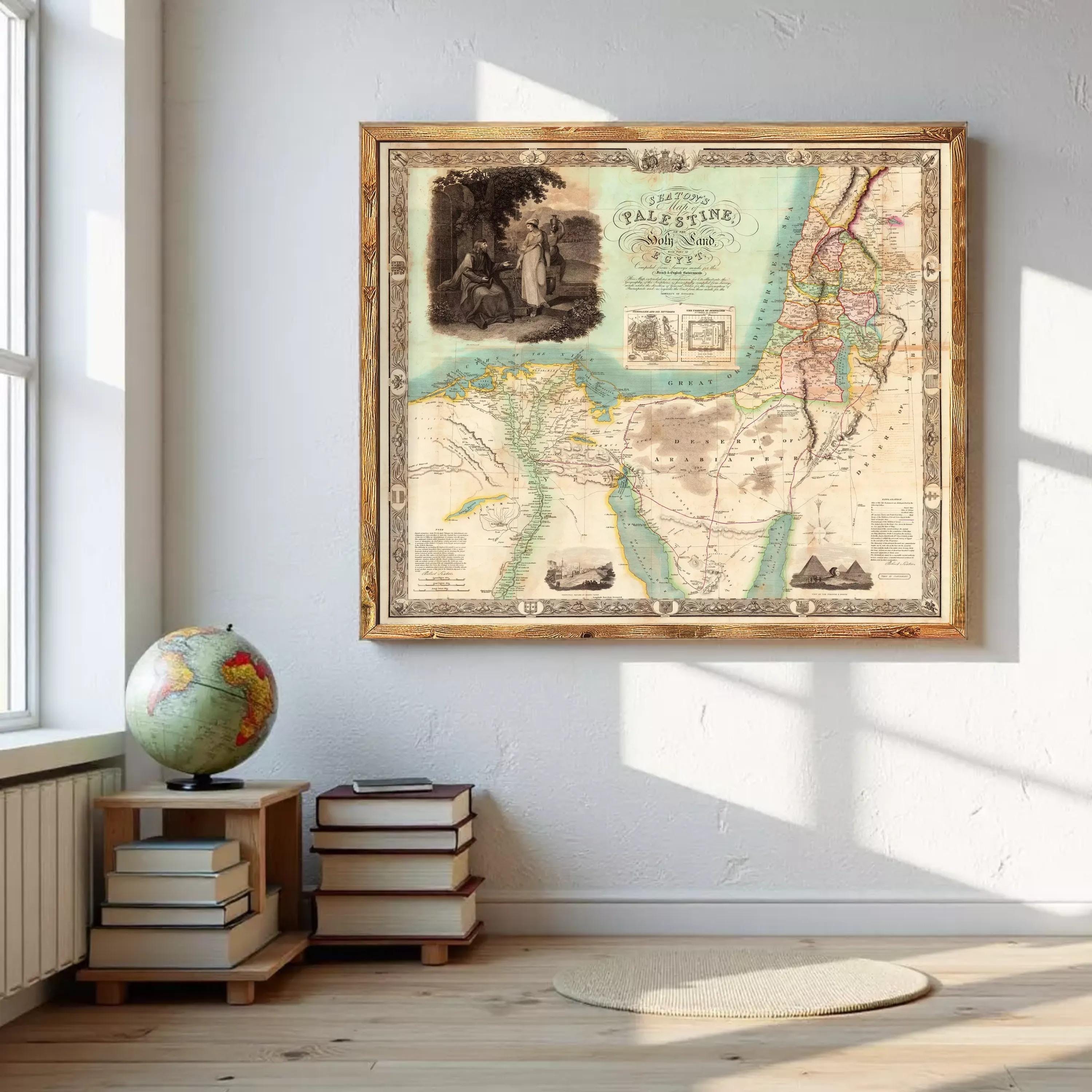 a large framed map of the Middle East and North Africa, with a vintage style and intricate details. The map is hung on a white wall, and there are several books and a globe placed nearby.