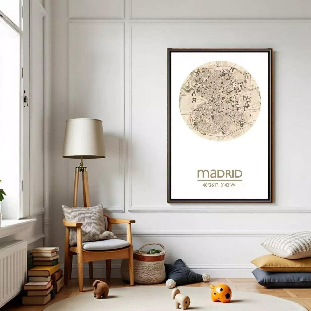 a cozy living room with a large framed map of Madrid hanging on the wall, a wooden chair, a lamp, and a stack of books.