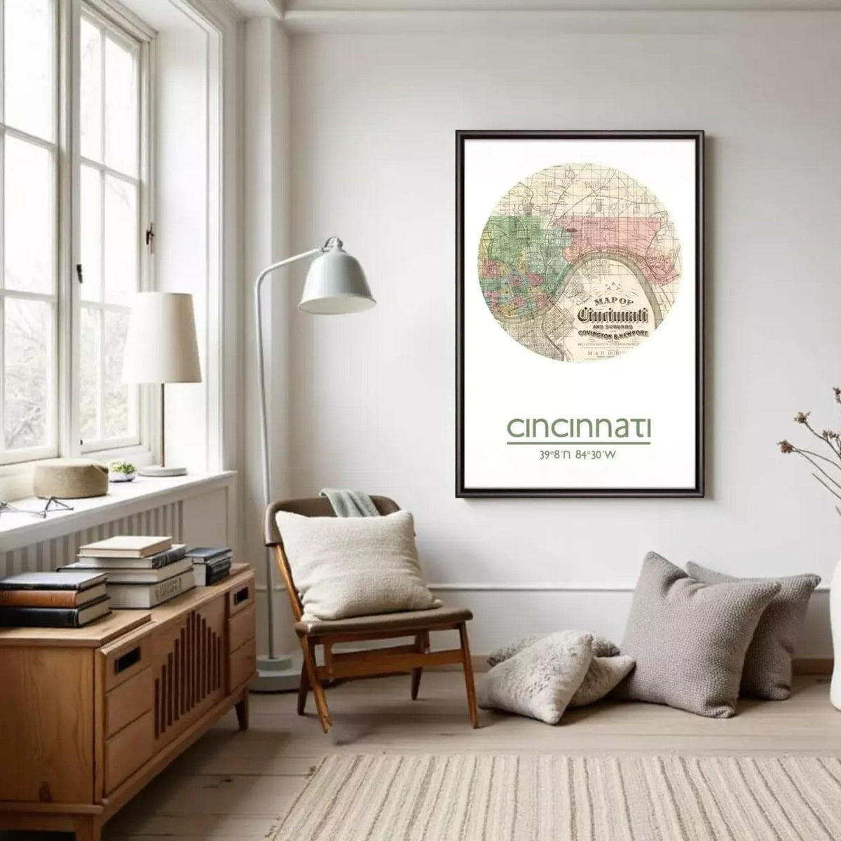 a cozy living room with a large framed map of Cincinnati hanging on the wall. The room is furnished with a wooden chair, a bookshelf, and a lamp. The overall atmosphere of the room is warm and inviting, with a focus on the map as the central decorative element.