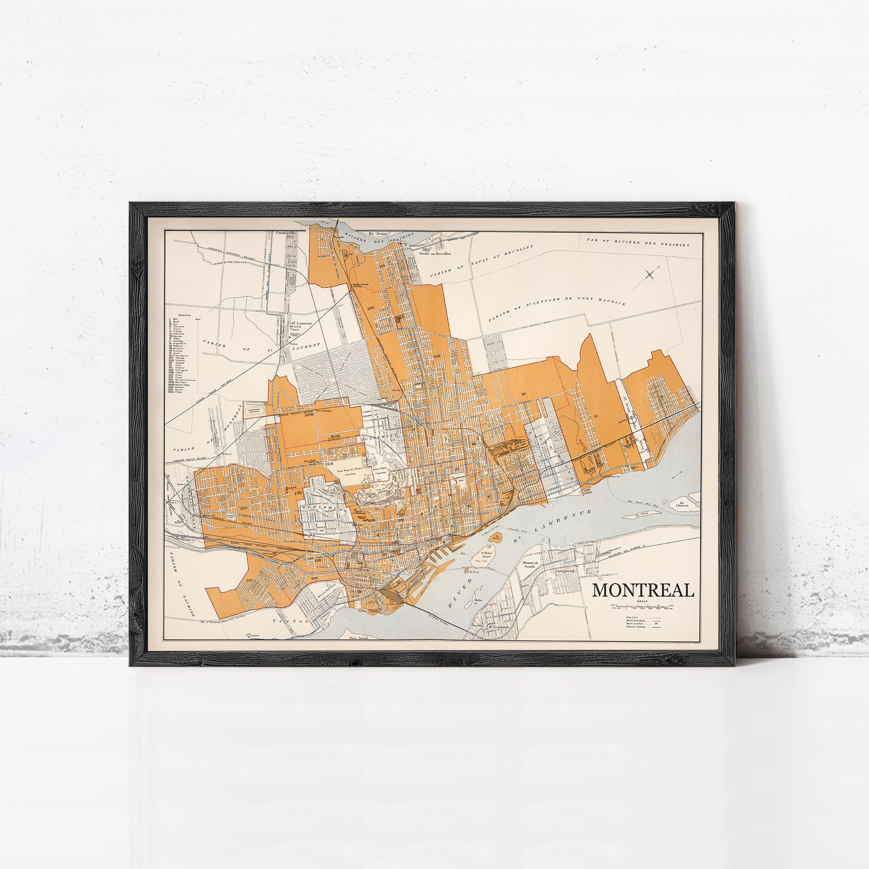 The image is a framed map of Montreal, Canada, depicting the city's streets and surrounding areas.