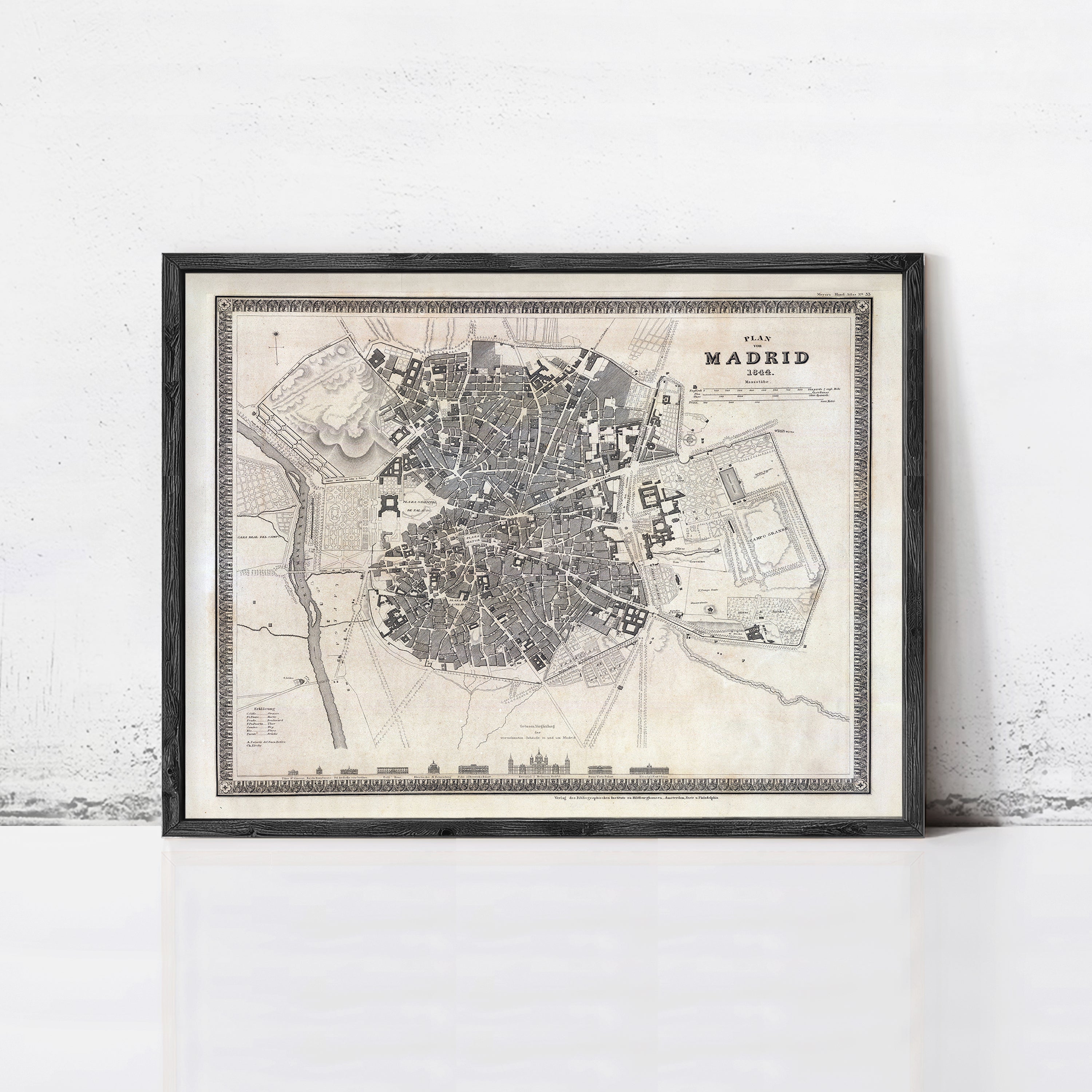 The image is a framed vintage map of Madrid, Spain, depicting the city's layout and surrounding areas.