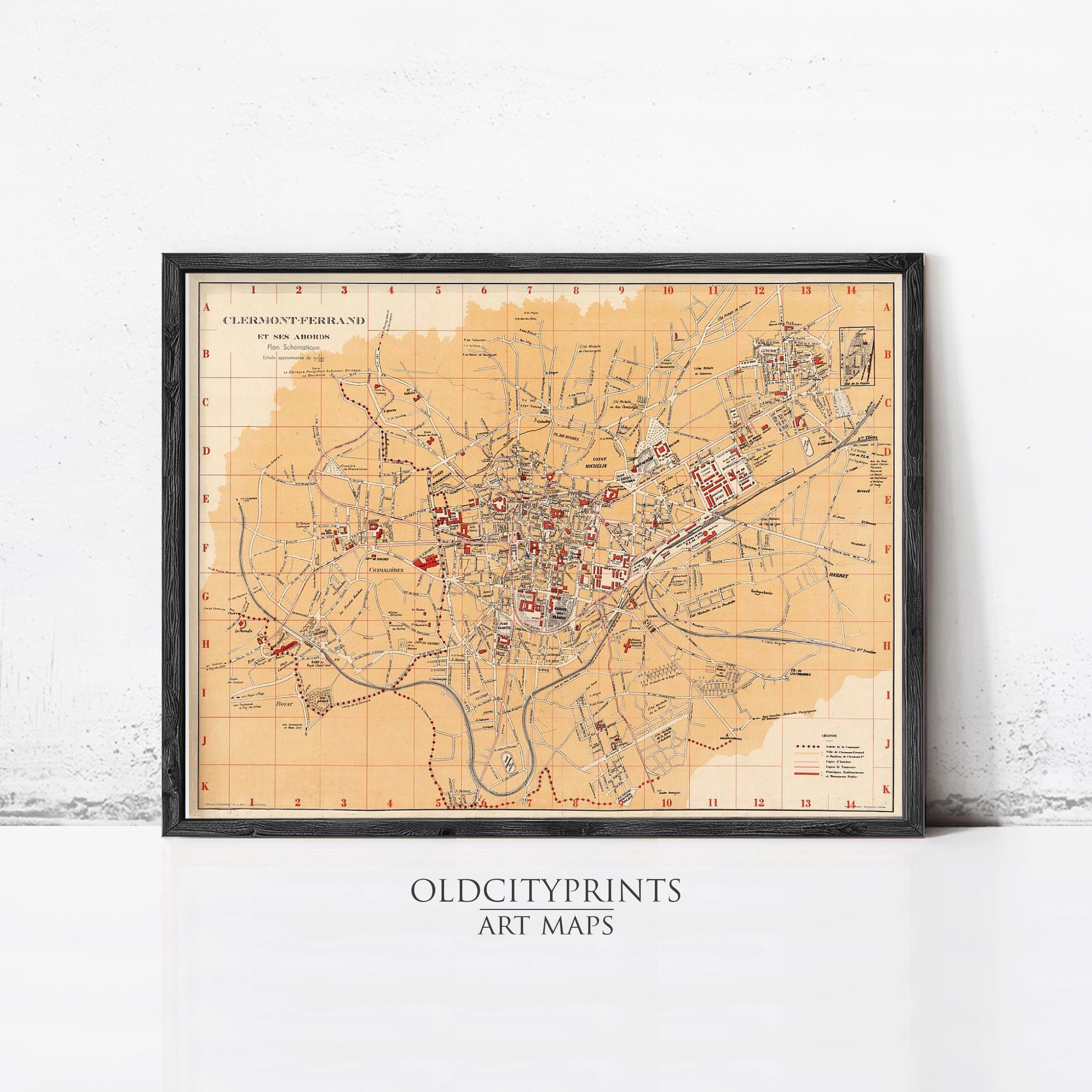 The image is a framed vintage map of a city, likely from the past, with various landmarks and streets depicted in a detailed manner.