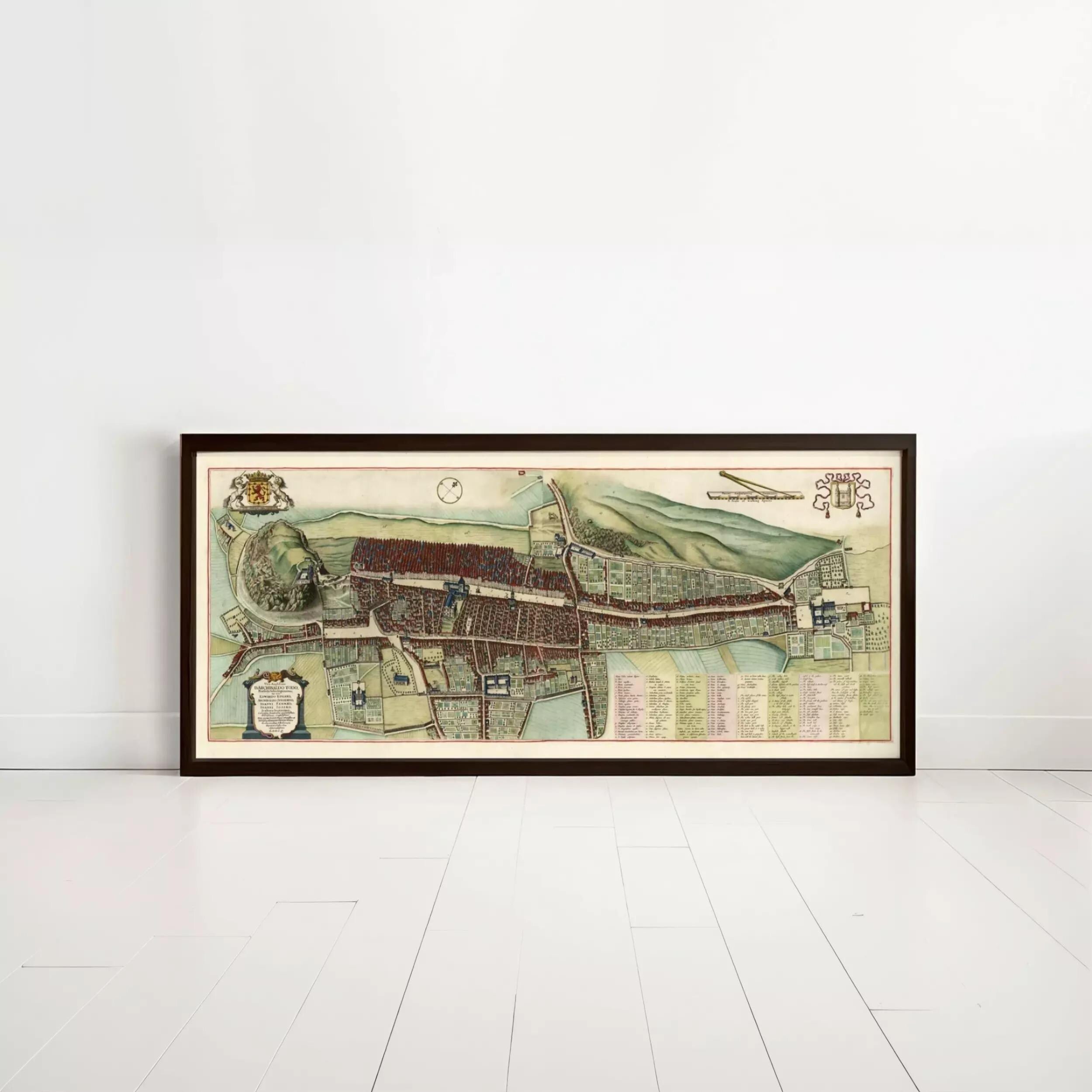 The image is a framed map of a city or town, depicting various streets, buildings, and landmarks.