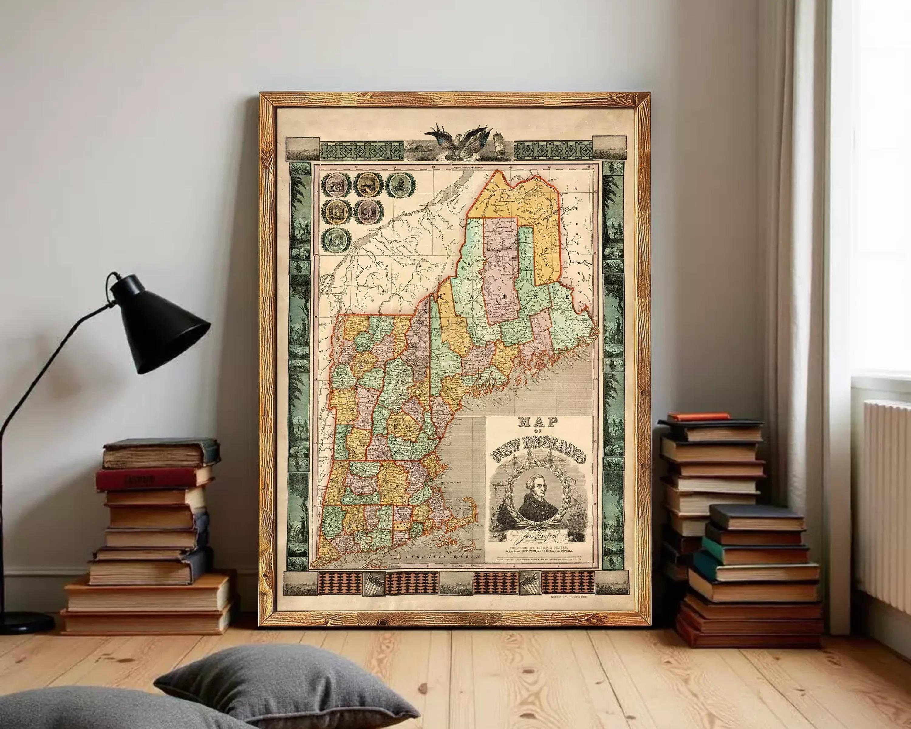 The image is a framed vintage map of New England, depicting the region in a detailed and colorful manner.