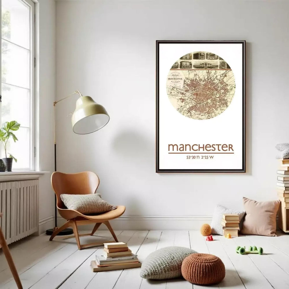 a cozy living room with a large framed map of Manchester hanging on the wall. The room has a comfortable seating area with a wooden chair and a floor lamp, and there are books and other decorative items scattered around the space.