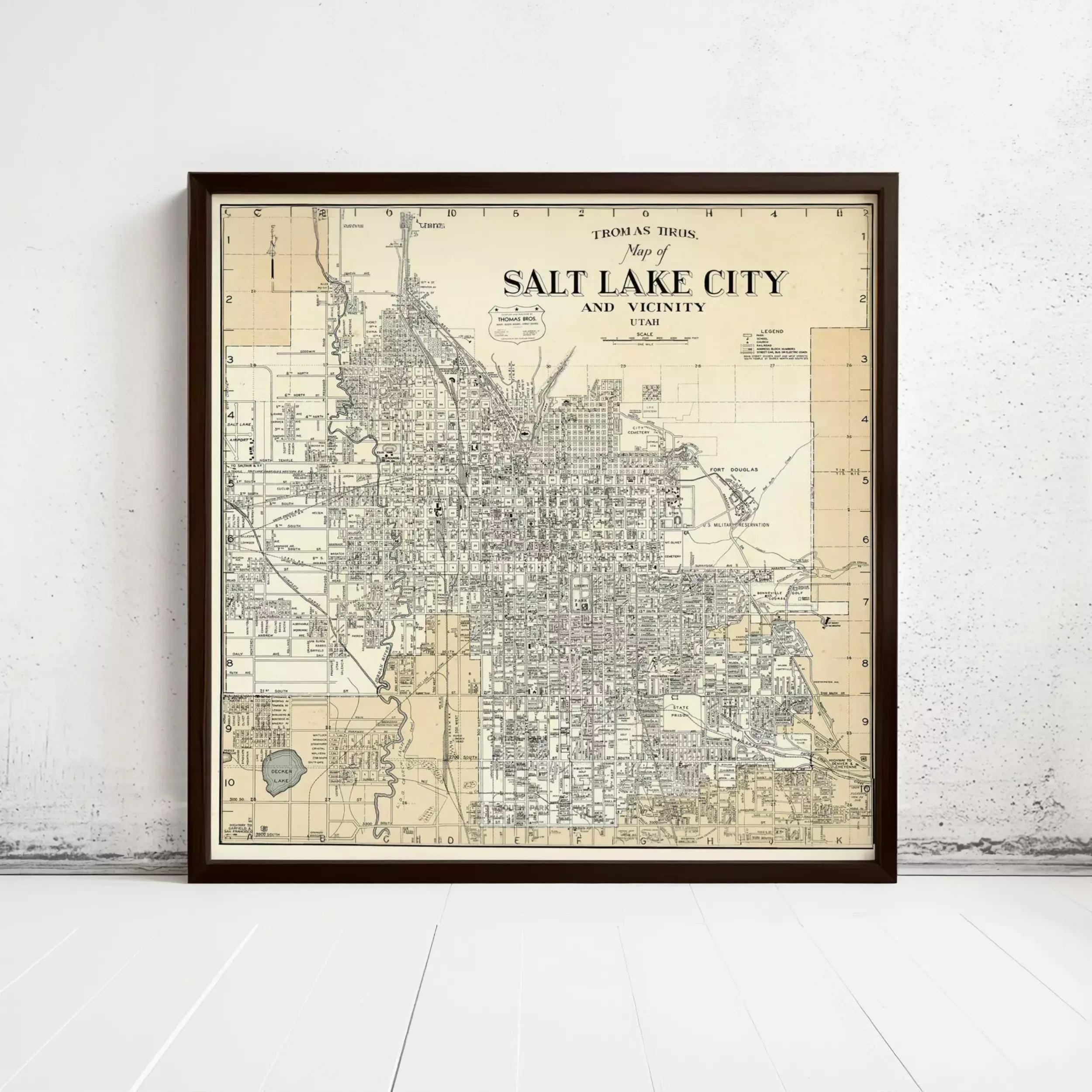 The image is a framed vintage map of Salt Lake City, Utah, depicting the city's streets and surrounding areas.