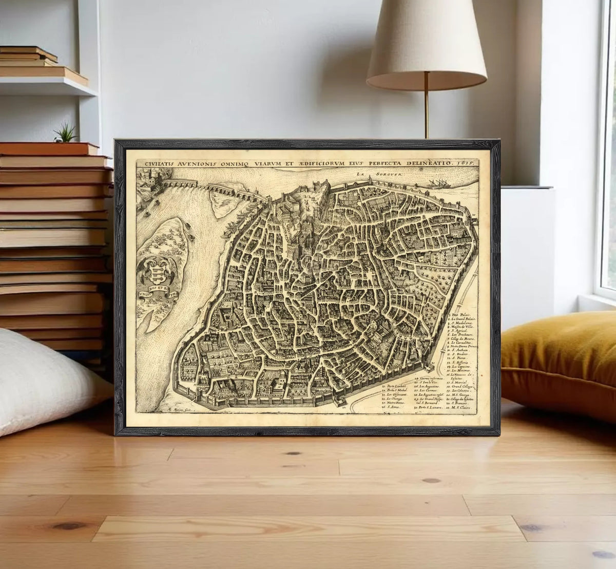 The image is a framed antique map of a city, likely from the 16th century, depicting a detailed layout of the city's streets and surrounding areas.