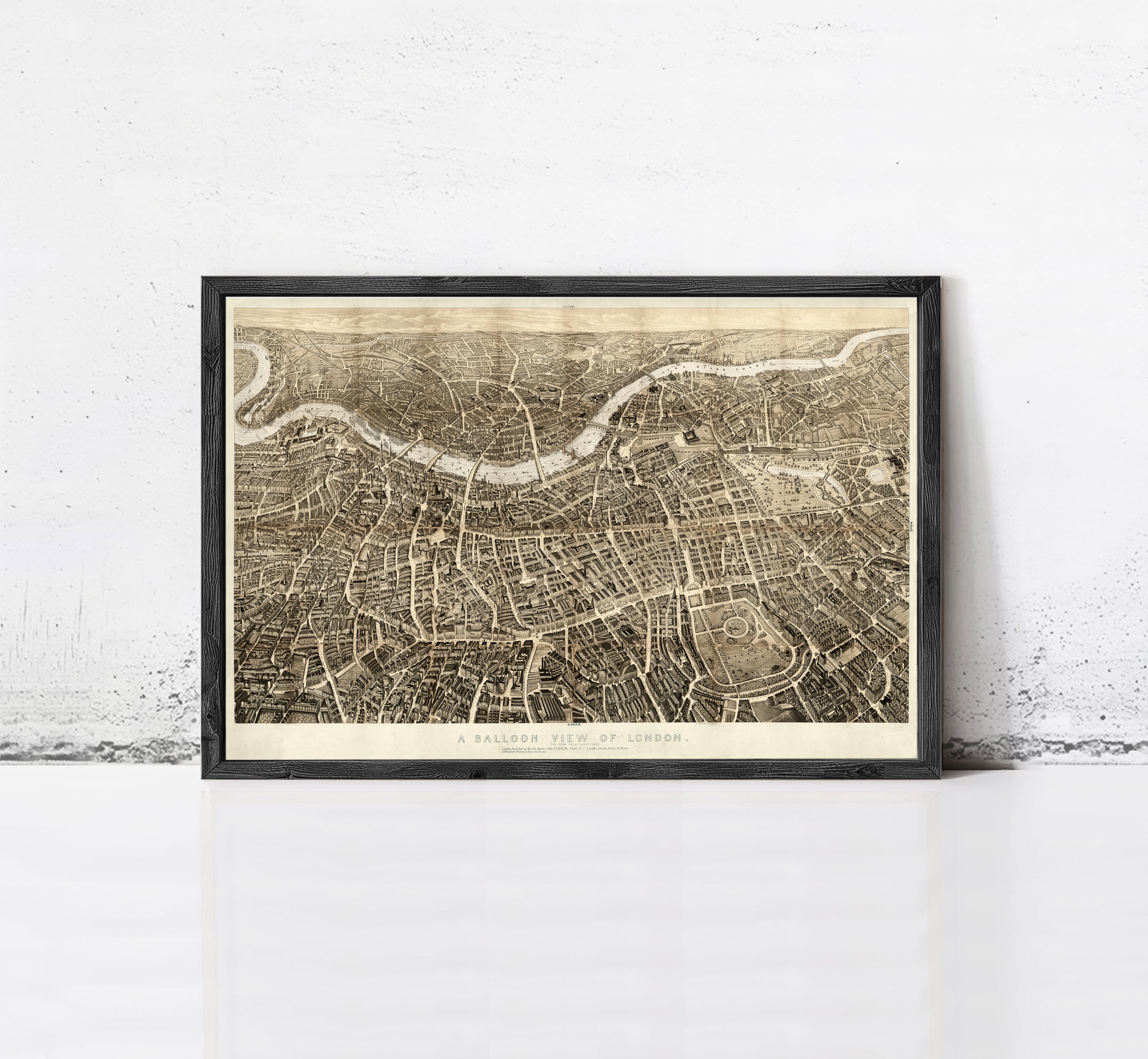 The image is a framed print of a detailed map of London, England, depicting the city's streets, landmarks, and waterways.