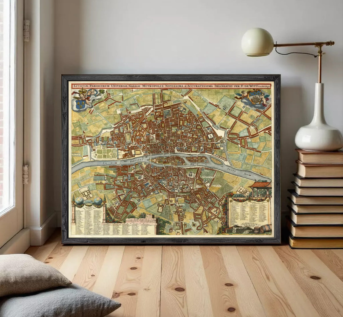 The image is a framed vintage map of a city, likely Paris, with detailed illustrations and labels.