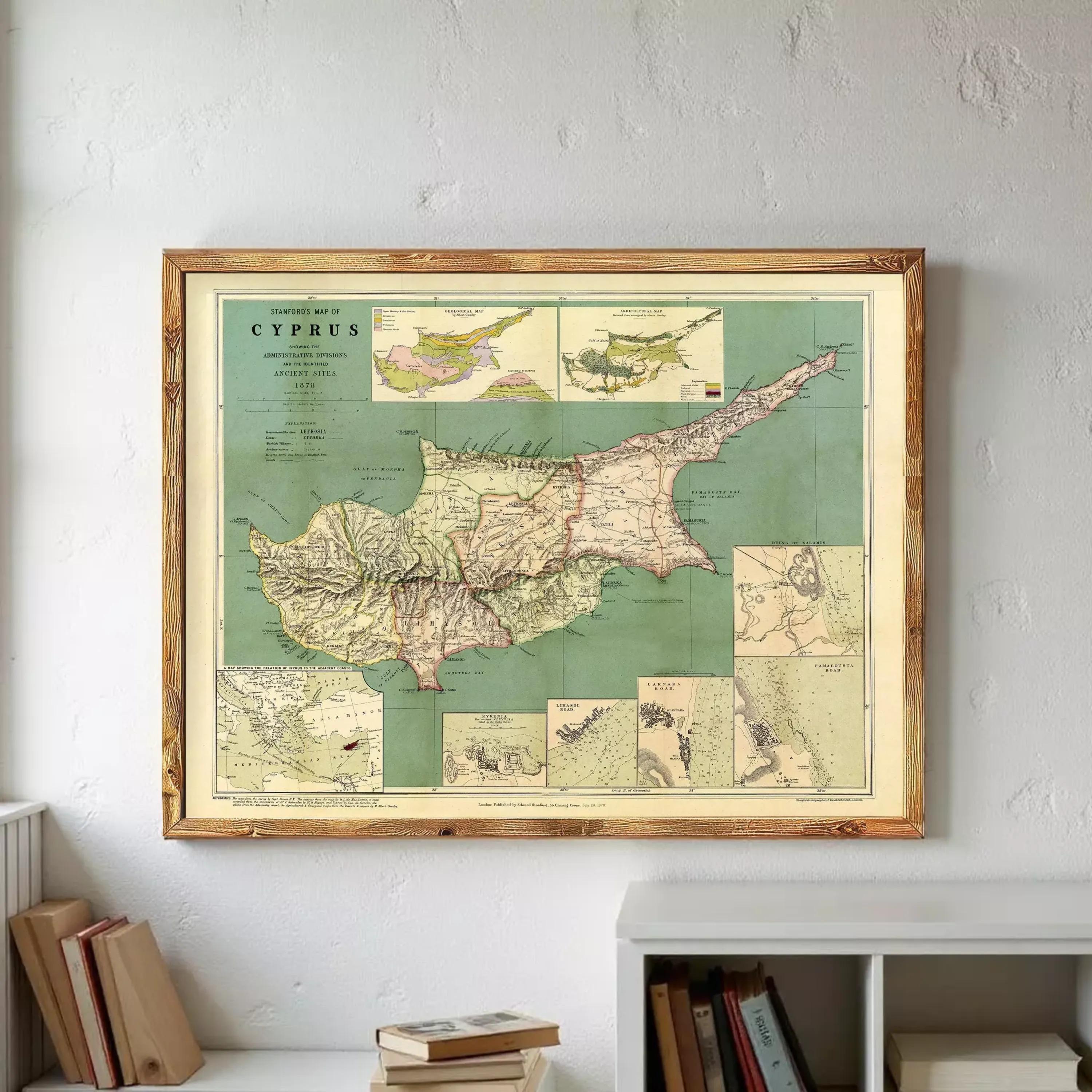 a framed vintage map of Cyprus hanging on a wall.