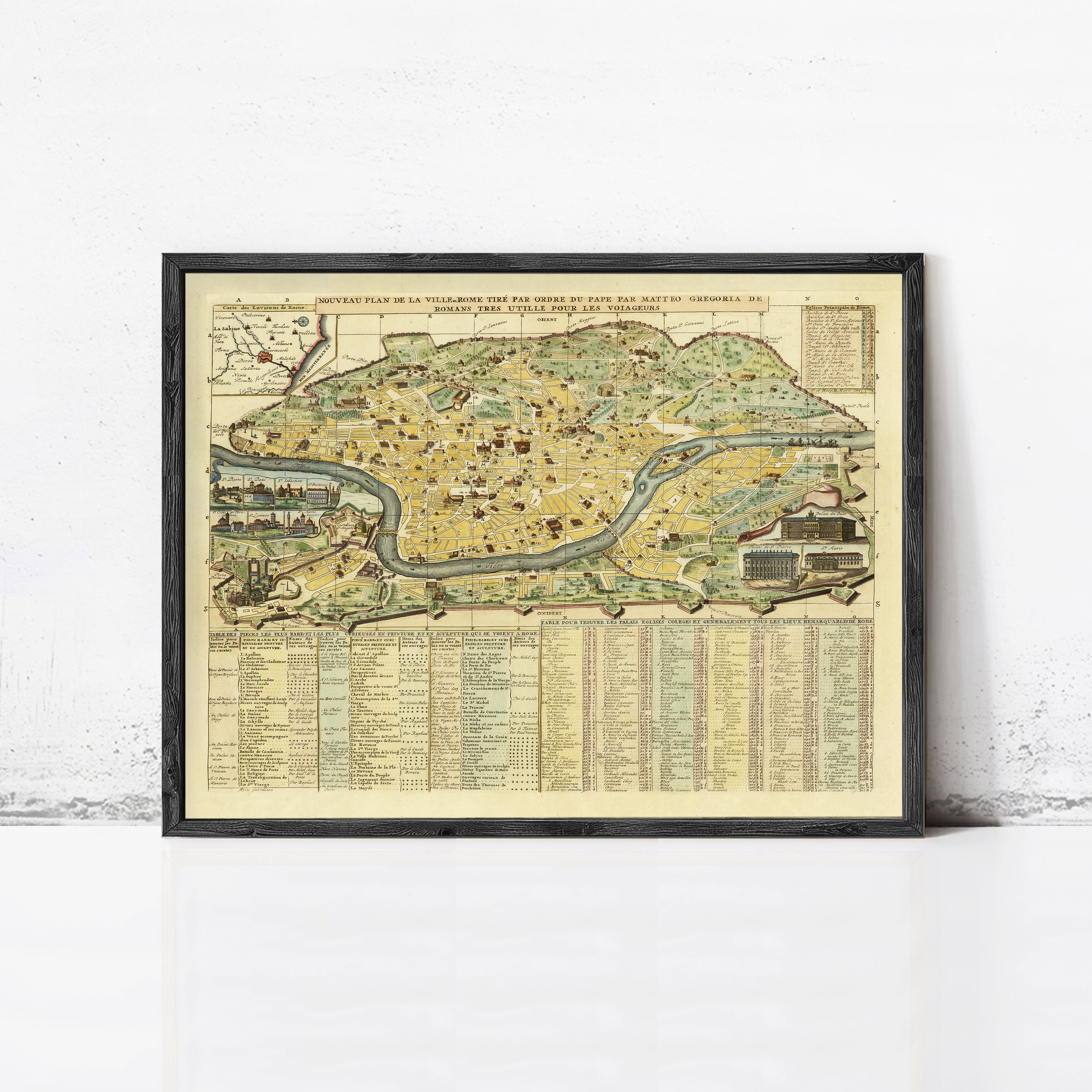 The image is a framed vintage map of a city, depicting various landmarks and streets.
