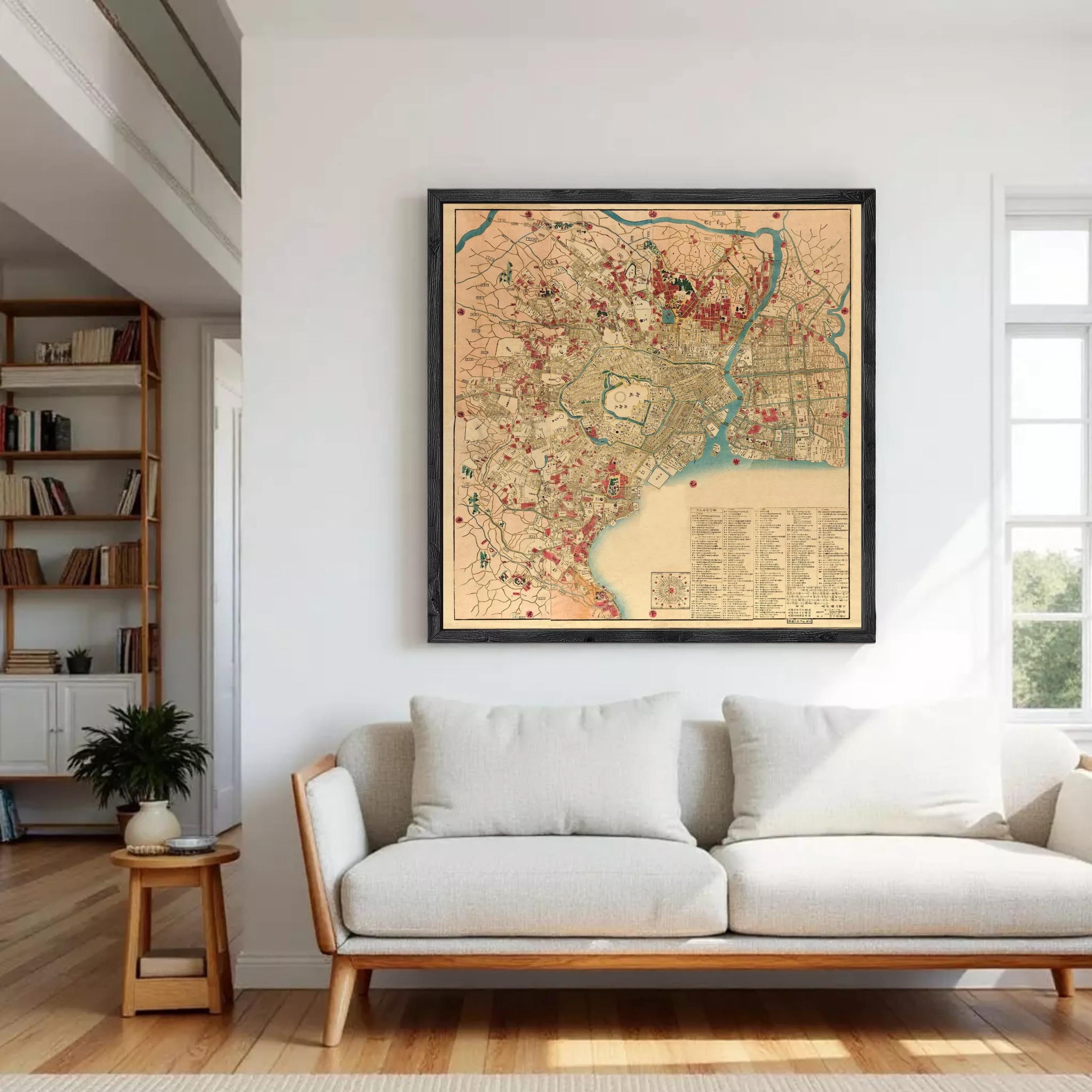 The image is a framed vintage map of a city, likely from the 19th century, with various landmarks and streets depicted in a detailed and colorful manner.