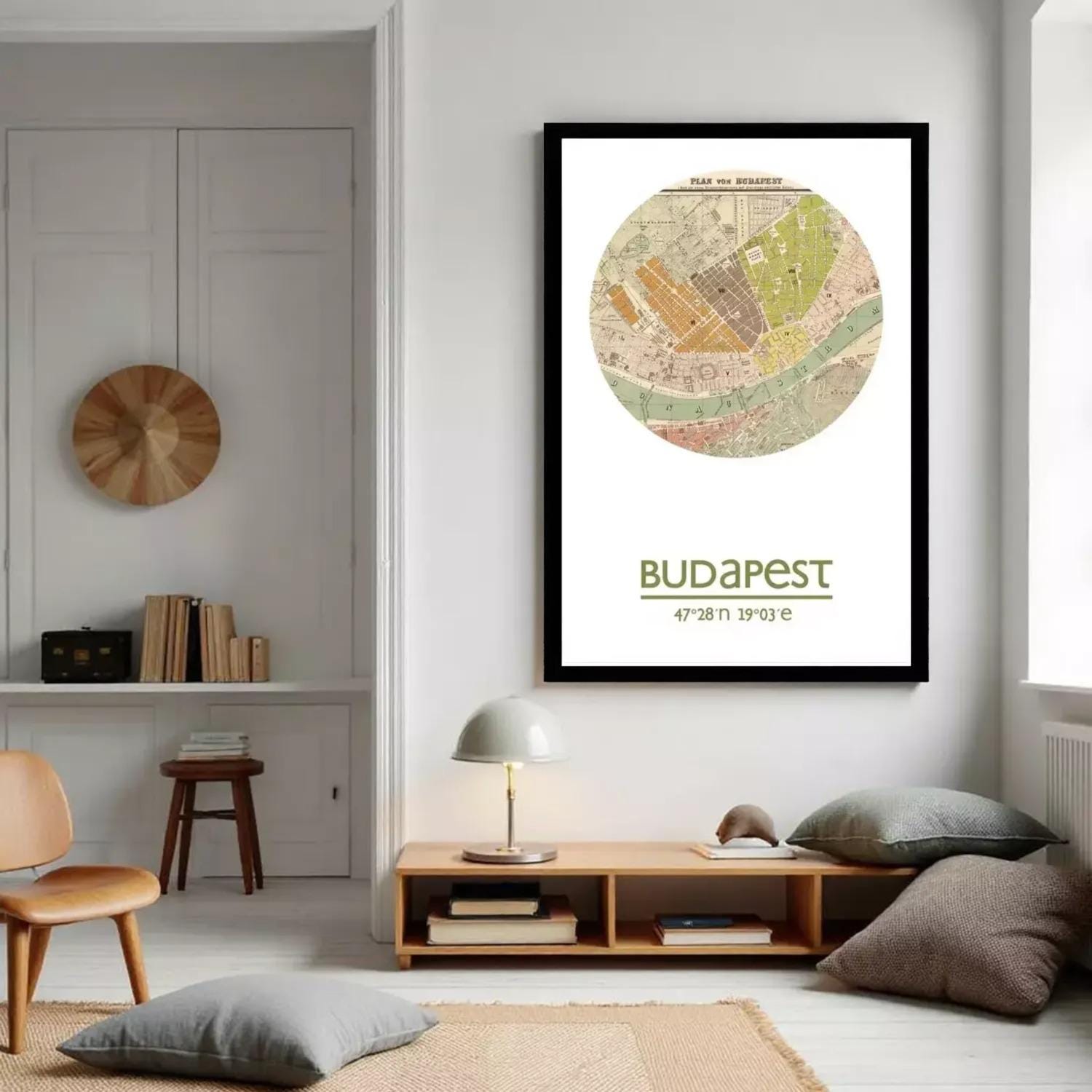 A framed vintage map of Budapest, Hungary, with the text "BUDAPEST" and the date "47.28.19.19.3 e" below the map.
