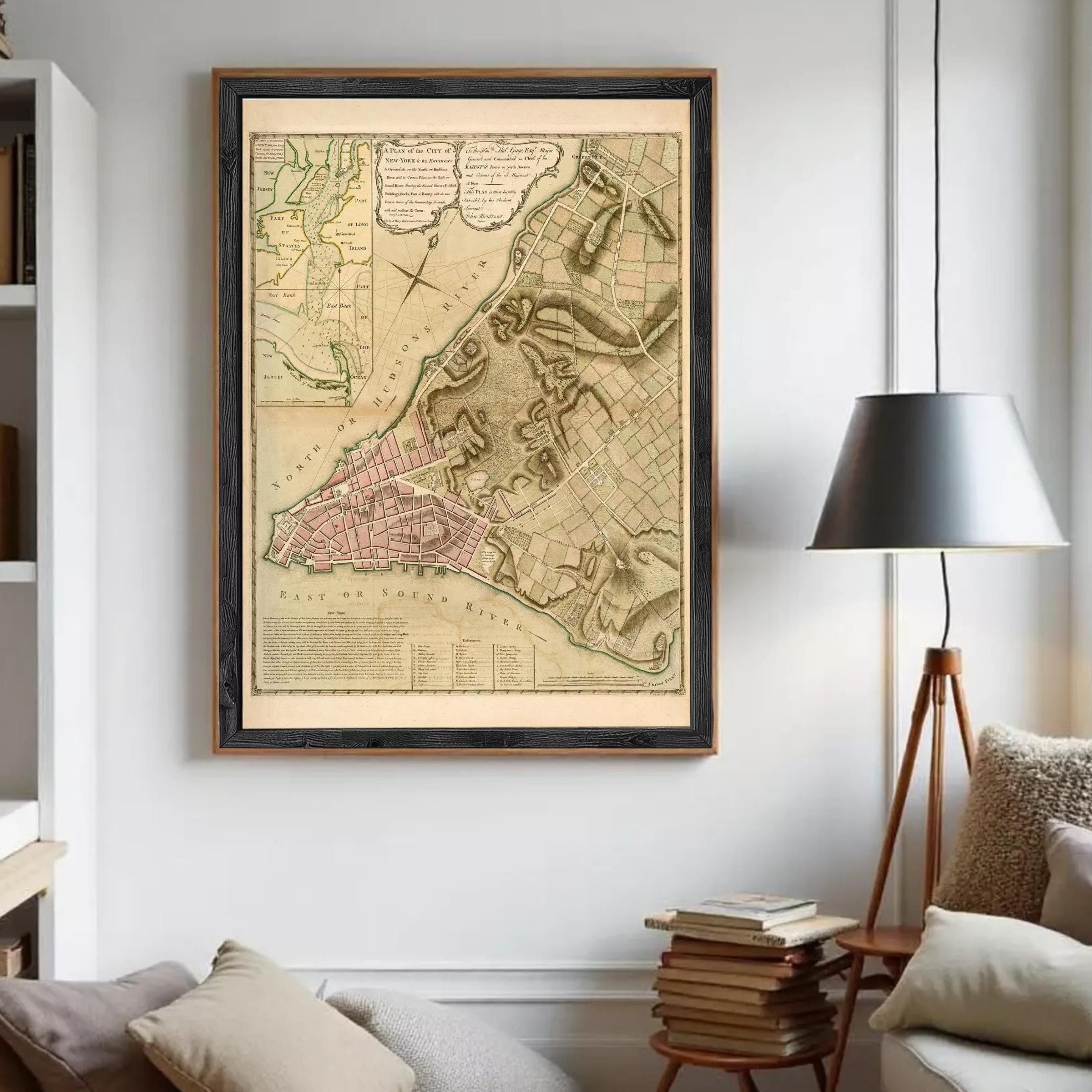 The image is a framed historical map of the city of New York, depicting the city's layout and surrounding areas.