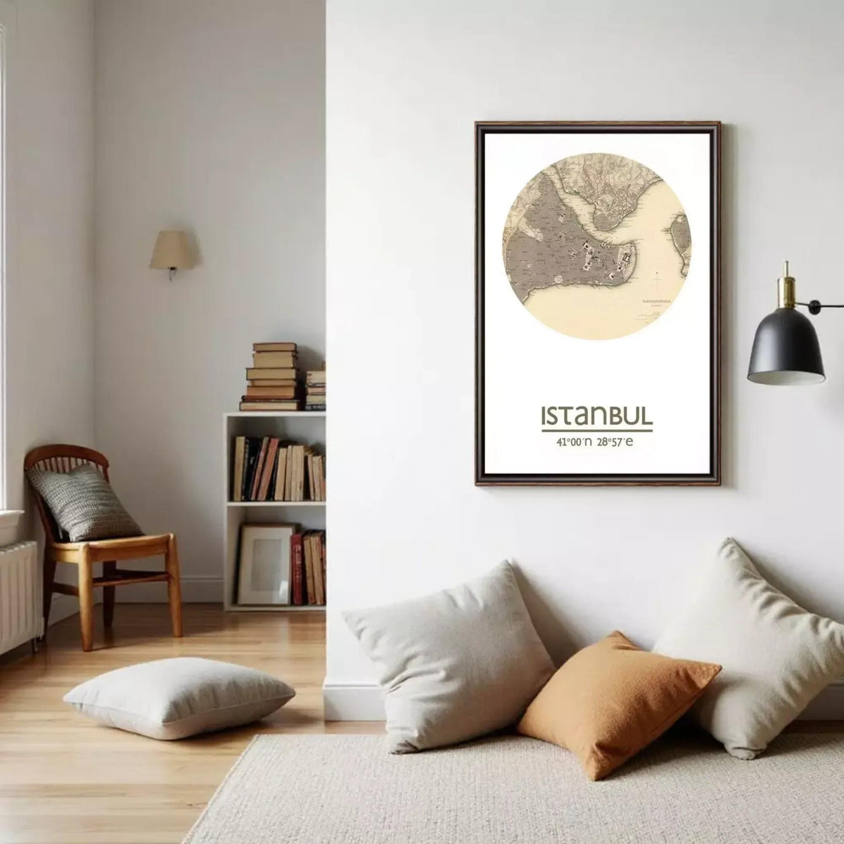 a living room with a framed map of Istanbul hanging on the wall, a bookshelf filled with books, and a wooden chair in the corner.