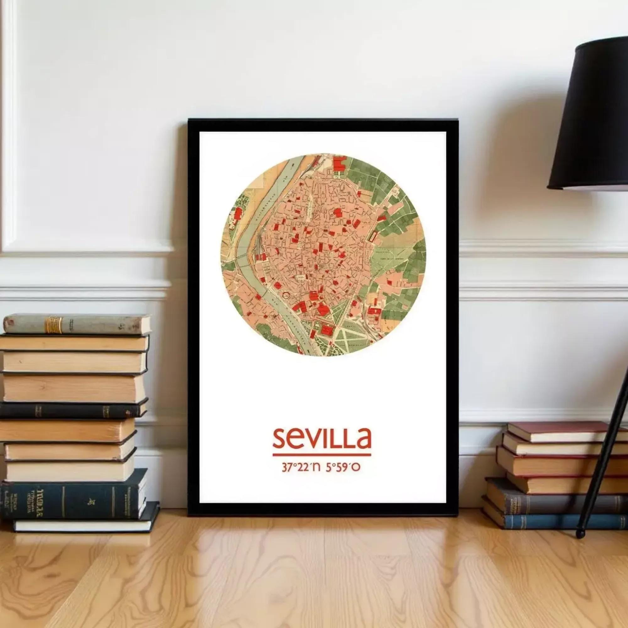 A framed map of Seville, Spain, with the text "seville" and "37.22°N 5.99°W" printed on it, is displayed on a wall next to a stack of books.