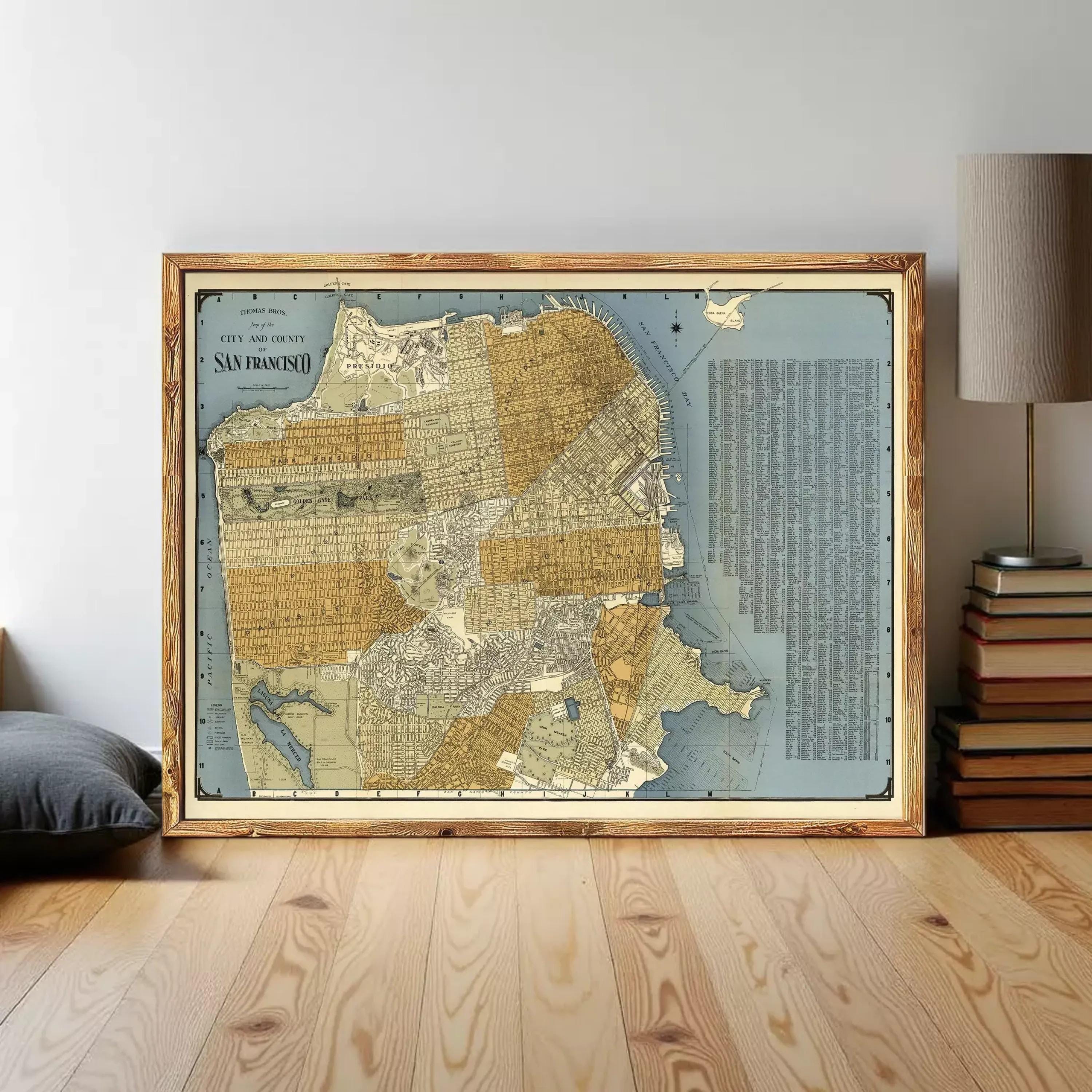 The image is a framed vintage map of San Francisco, California, with a detailed and colorful depiction of the city's streets, landmarks, and surrounding areas.