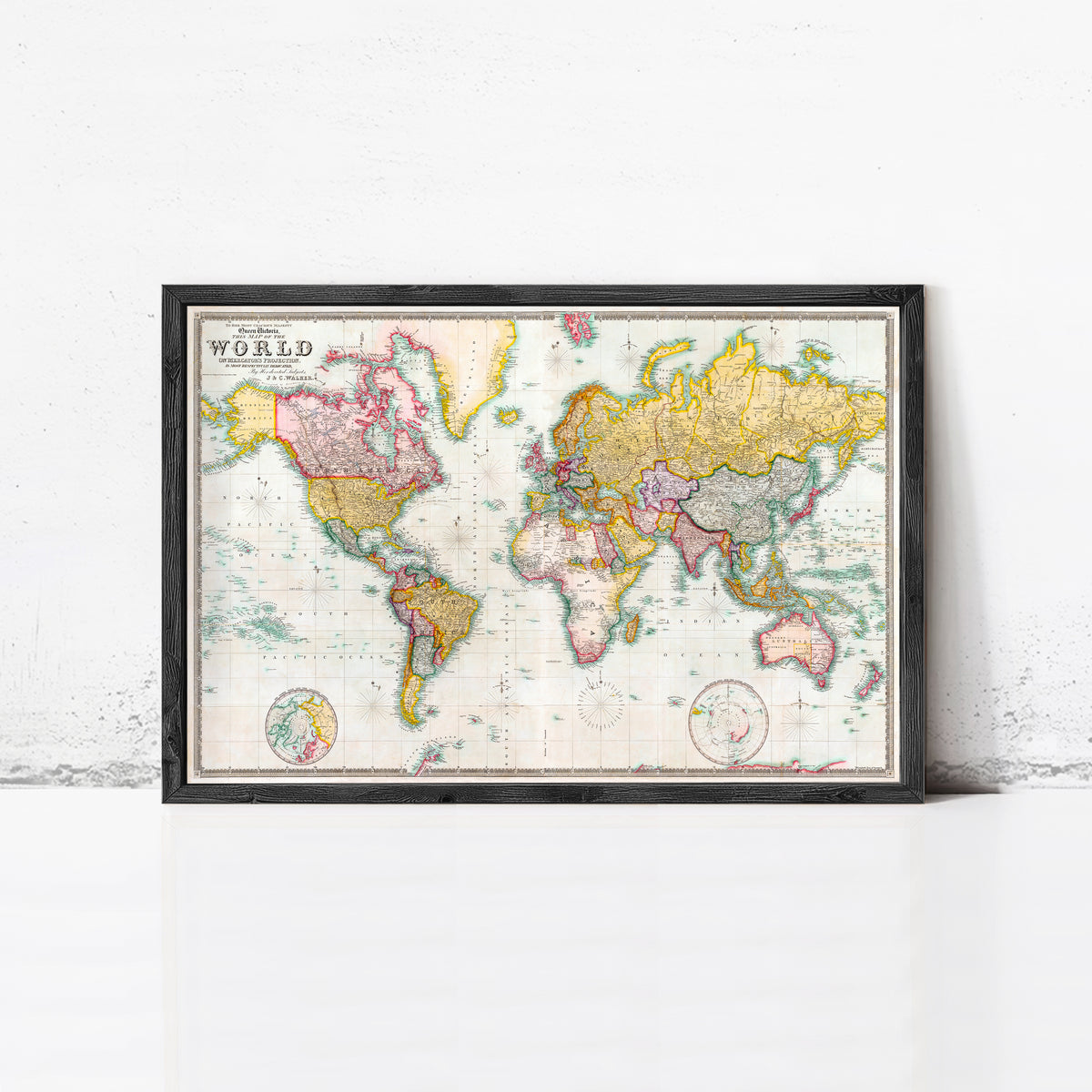 The image is a framed vintage world map with colorful borders and detailed country borders.
