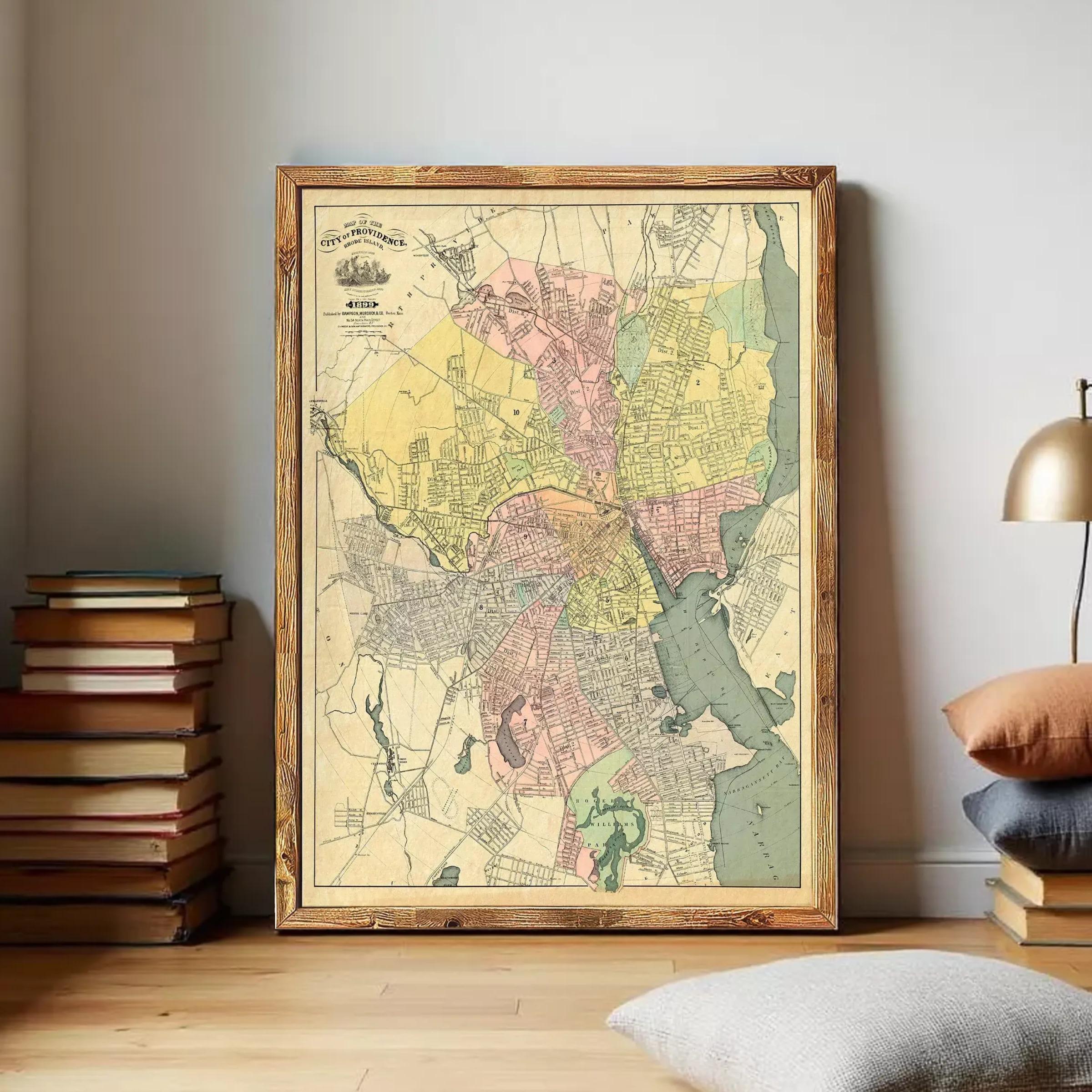 The image is a framed vintage map of a city, likely from the 19th century, with a wooden frame.