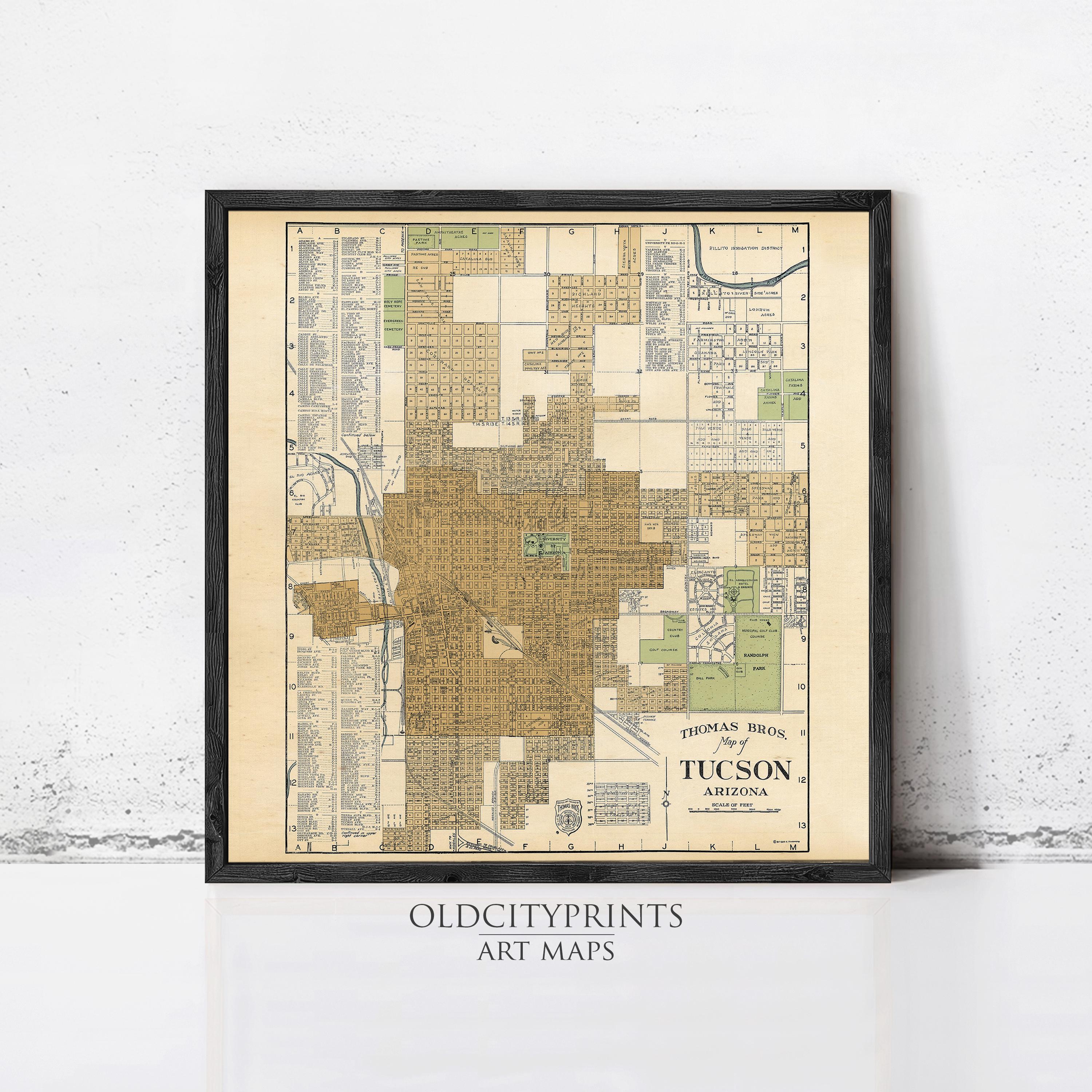 The image is a framed vintage map of Tucson, Arizona, depicting the city's layout and surrounding areas.