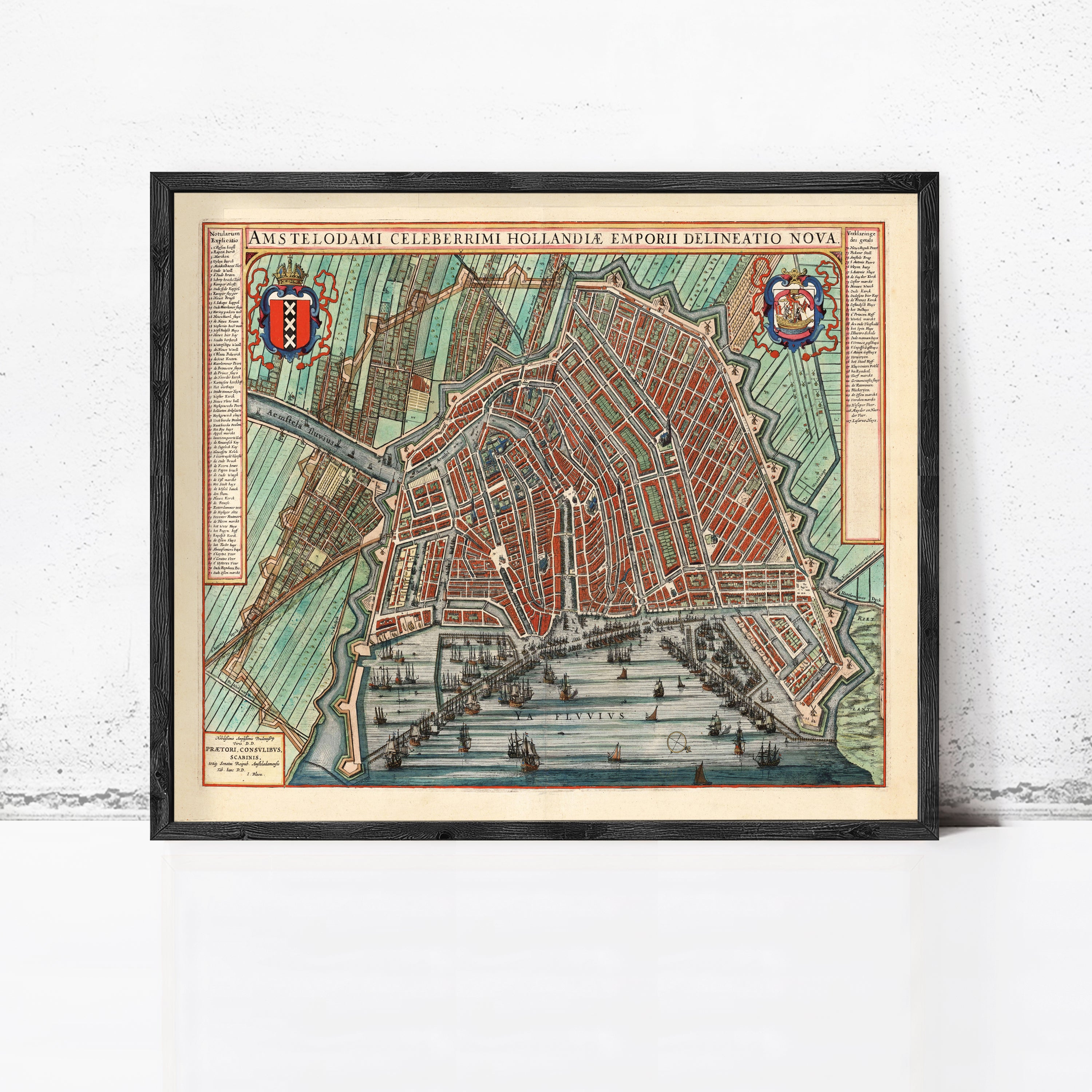 The image is a framed vintage map of Amsterdam, Netherlands, depicting the city's layout and surrounding areas.