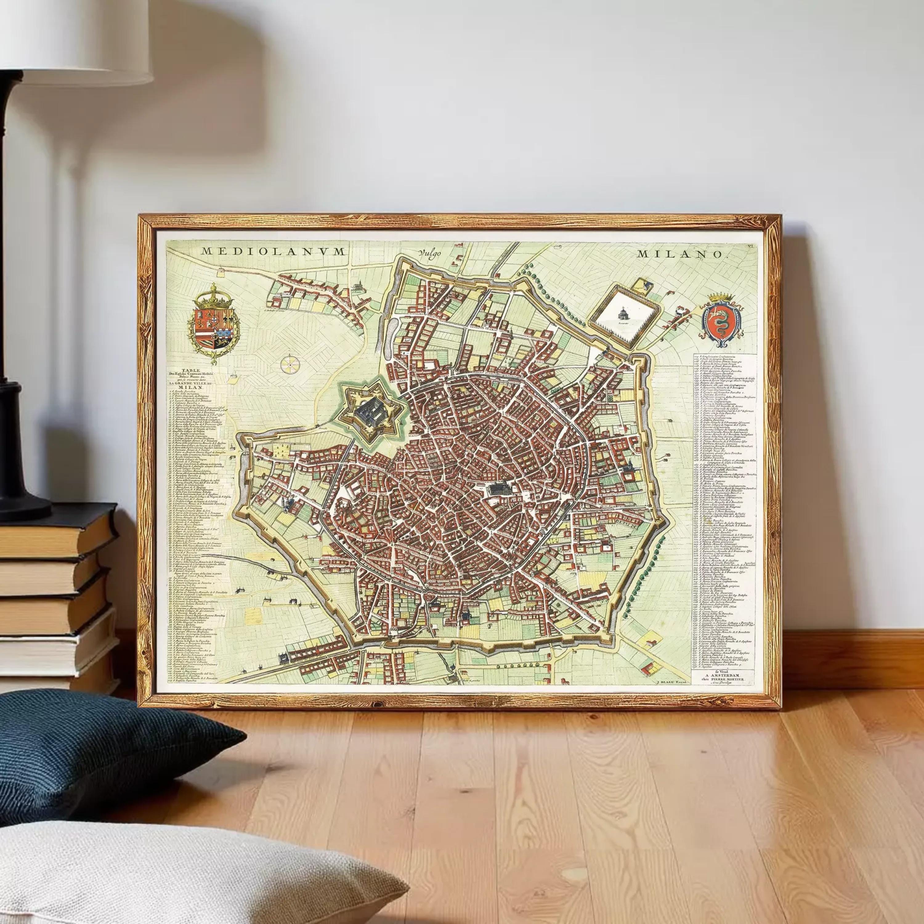 The image is a framed map of Milan, Italy, depicting the city's layout and streets.