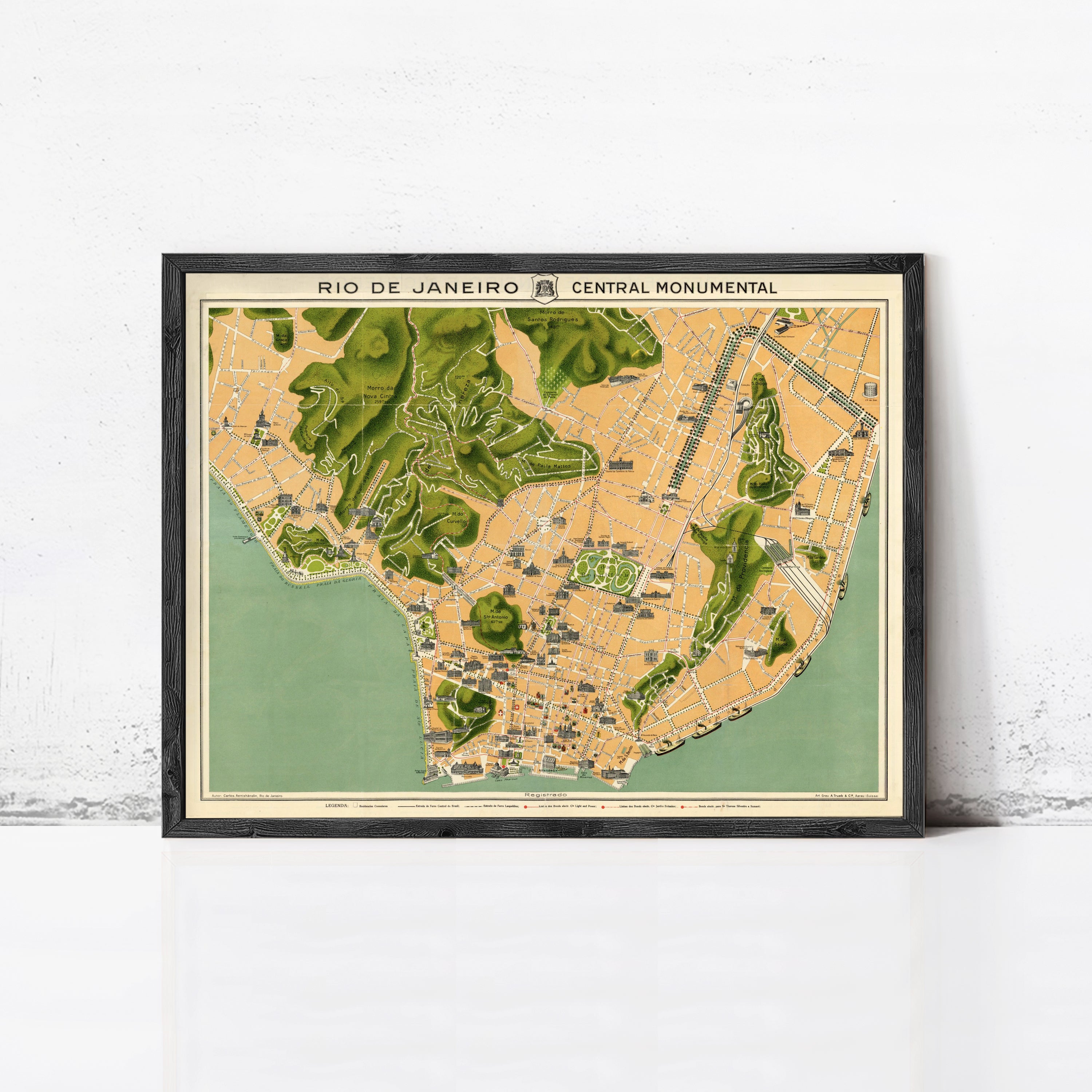 The image is a framed map of Rio de Janeiro, Brazil, depicting the city's central monument.