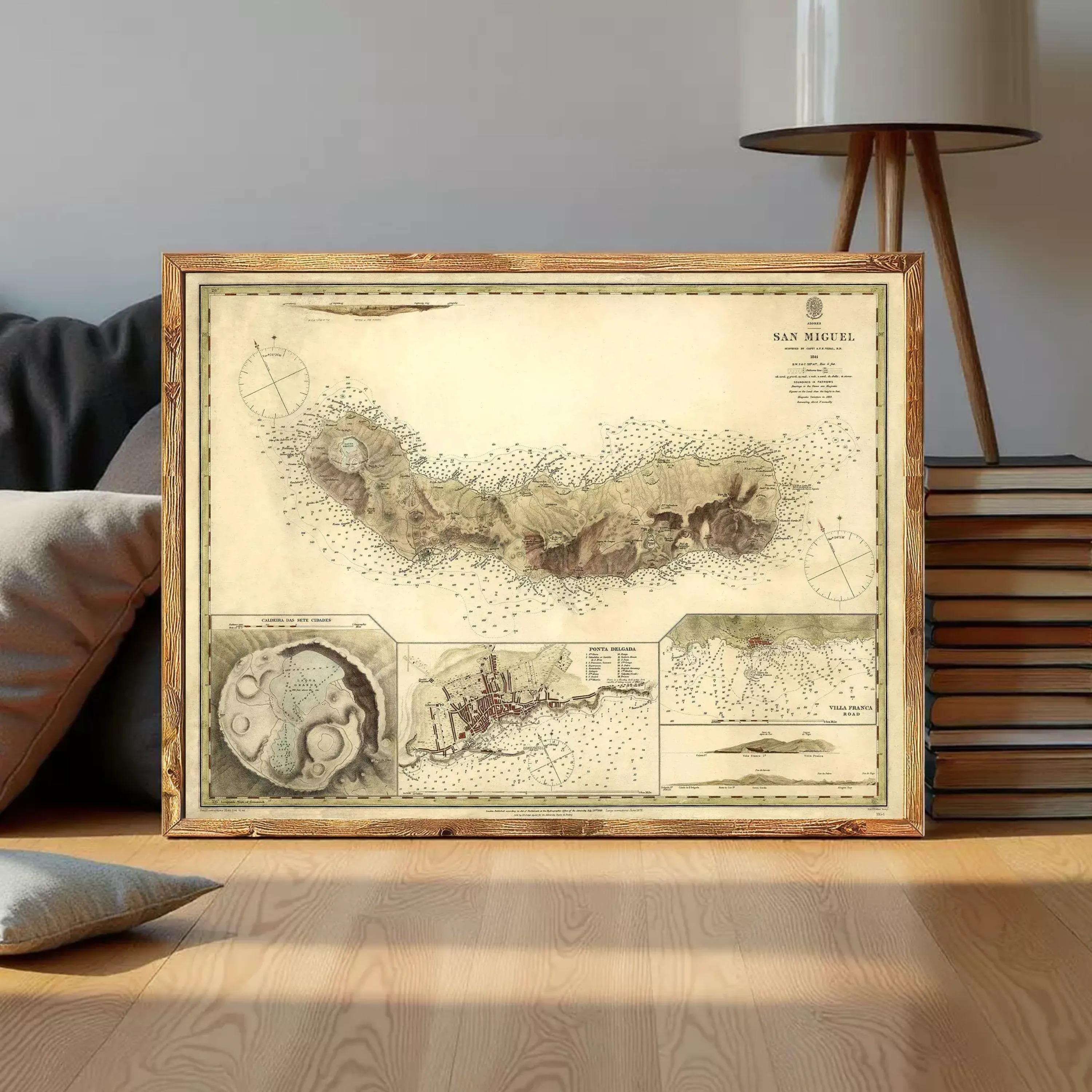 a framed map of San Miguel, a map of the San Miguel River, and a small illustration of a ship.
