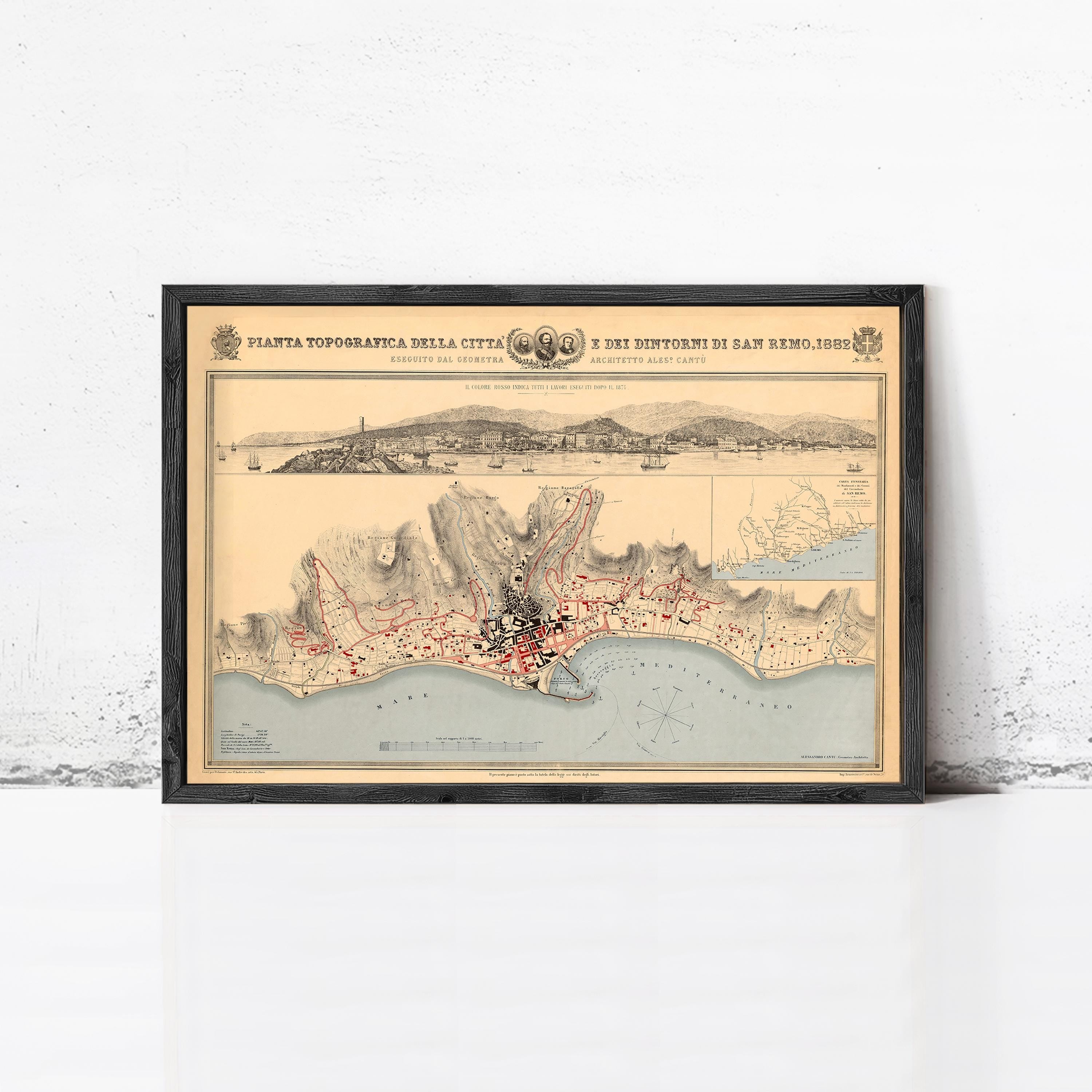 The image is a framed vintage map of a coastal city, depicting the city's layout, surrounding areas, and possibly a bay or ocean.