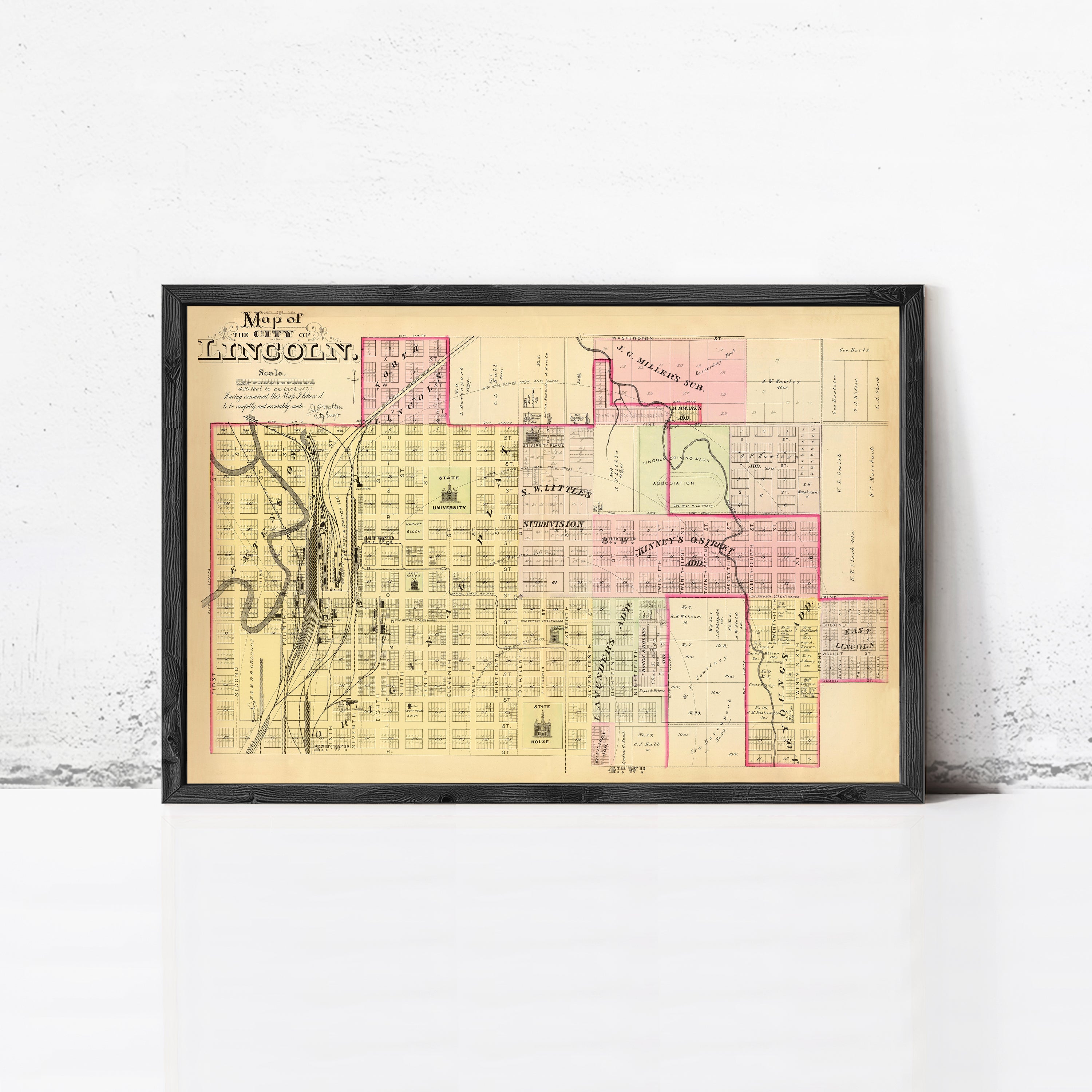 The image is a framed map of the city of Lincoln, showing the layout of the city and surrounding areas.