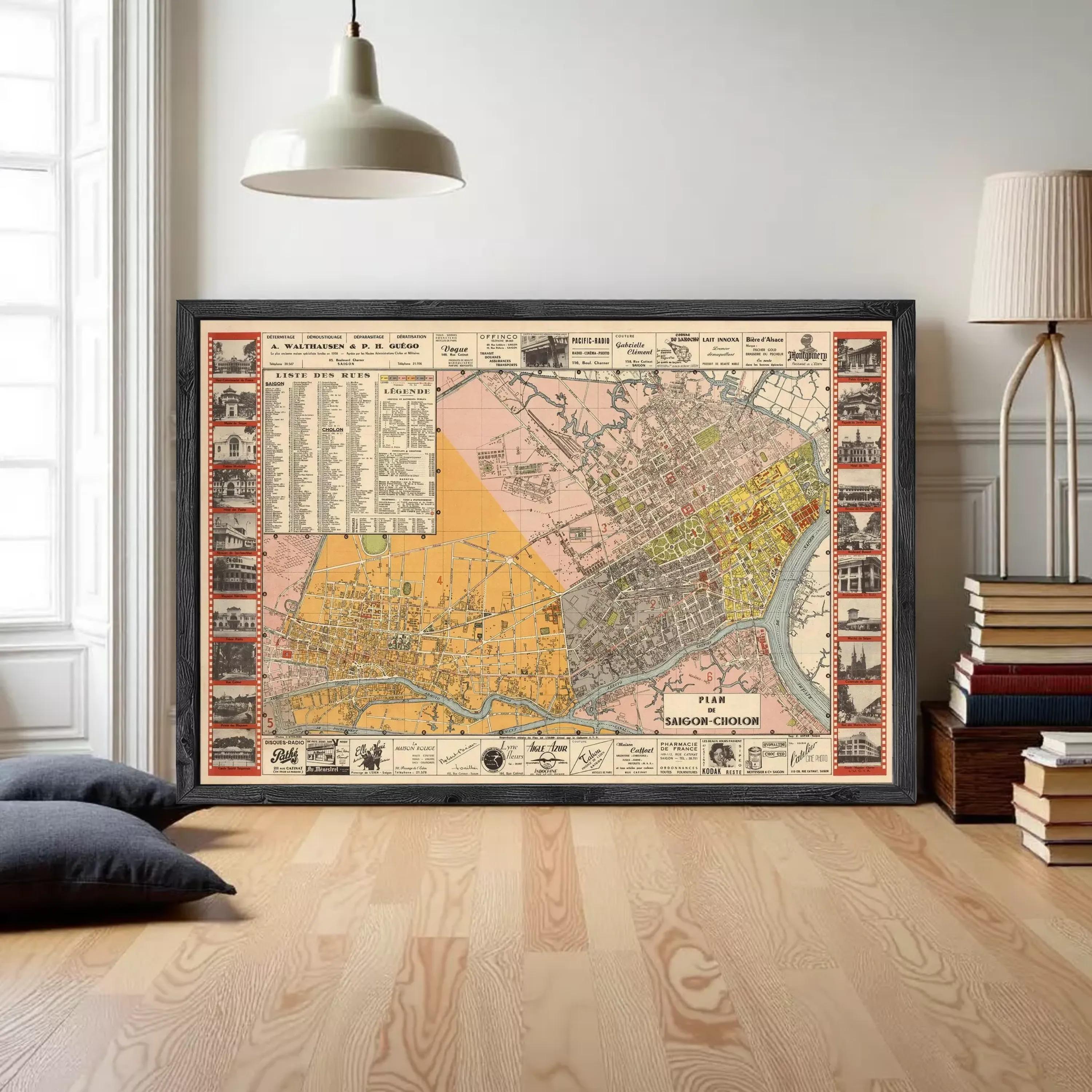 The image is a framed vintage map of a city, likely from the early 20th century, with various landmarks and streets depicted.