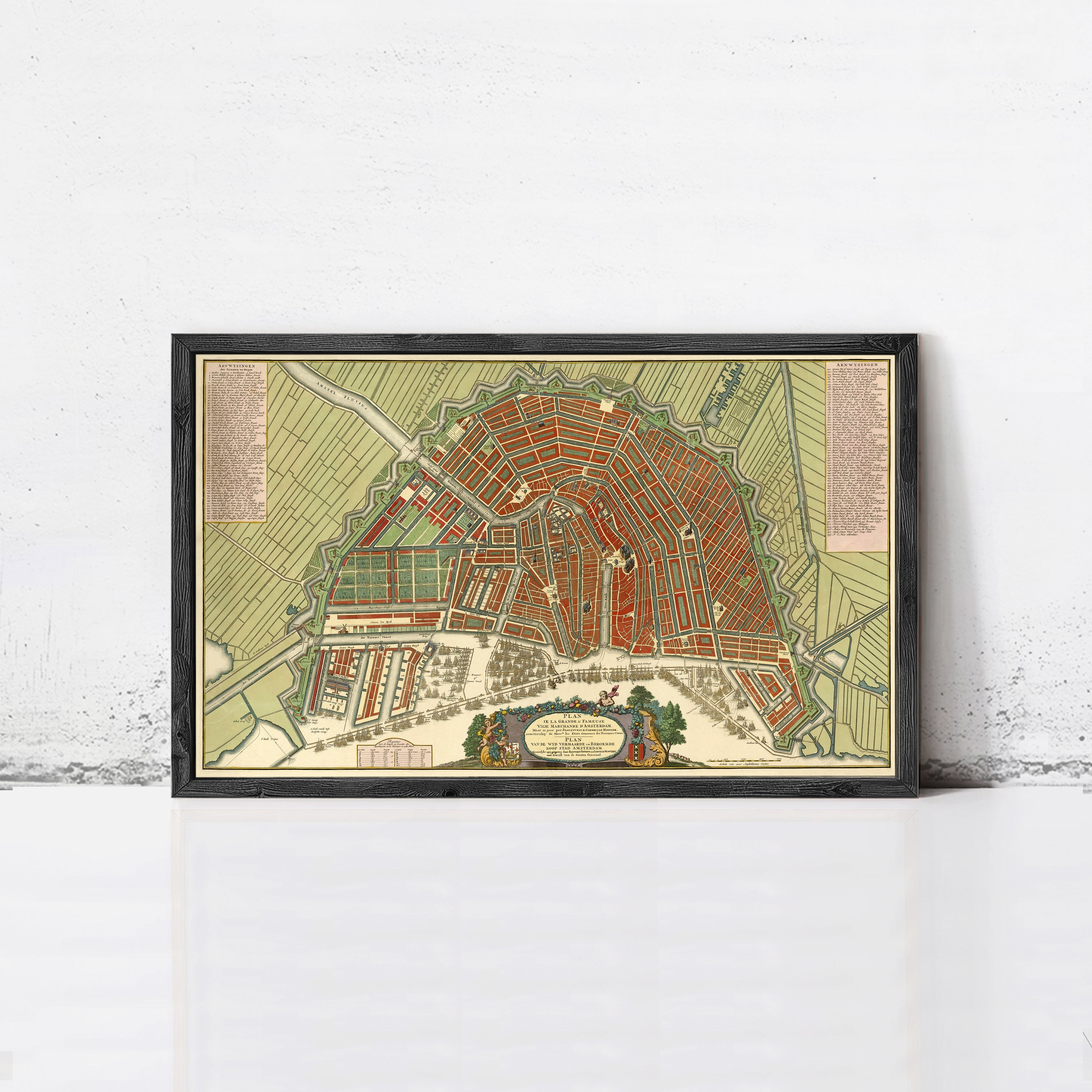 The image is a framed map of a city, depicting a detailed layout of streets, buildings, and other urban features.