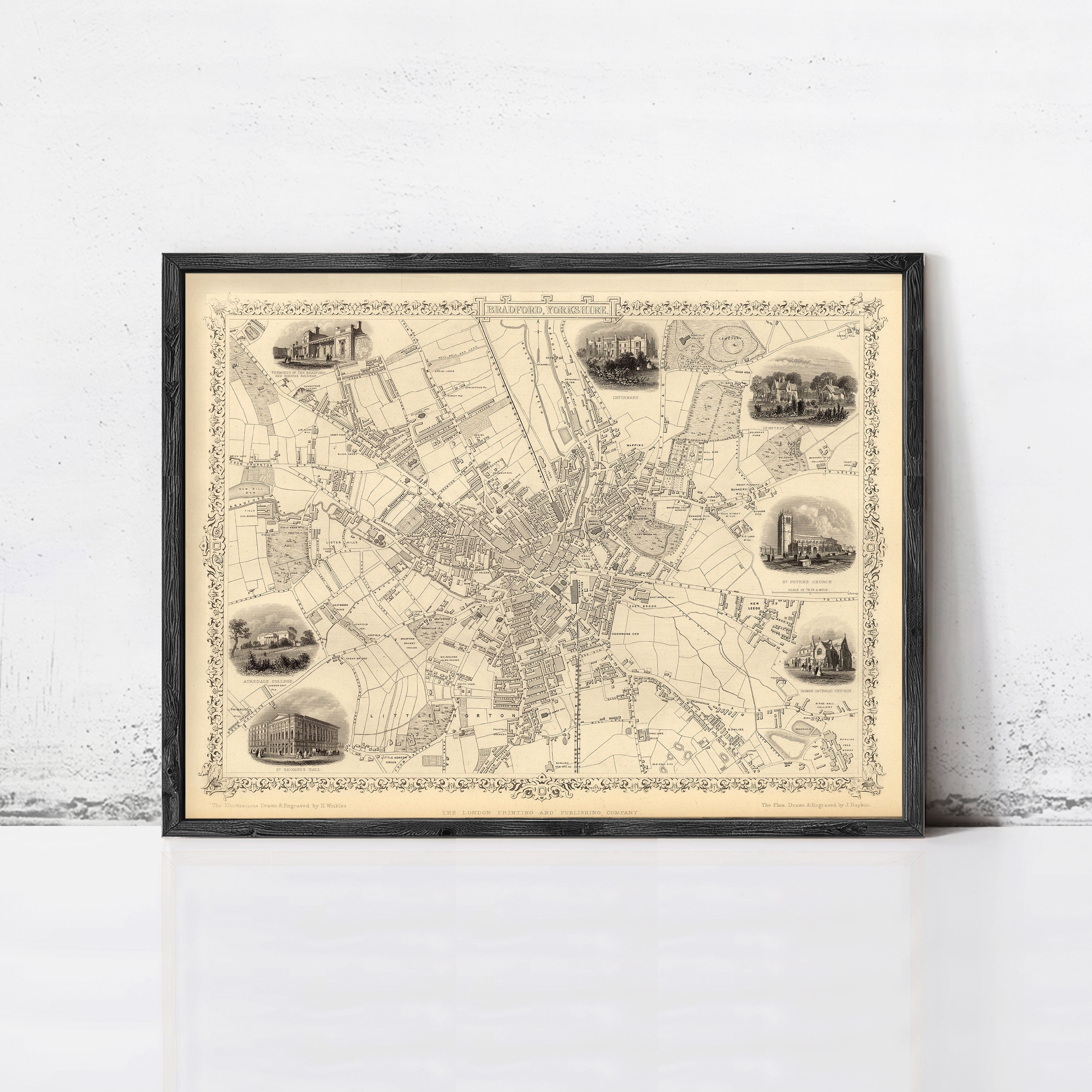 The image is a framed map of a city, with various landmarks and streets depicted in black and white.