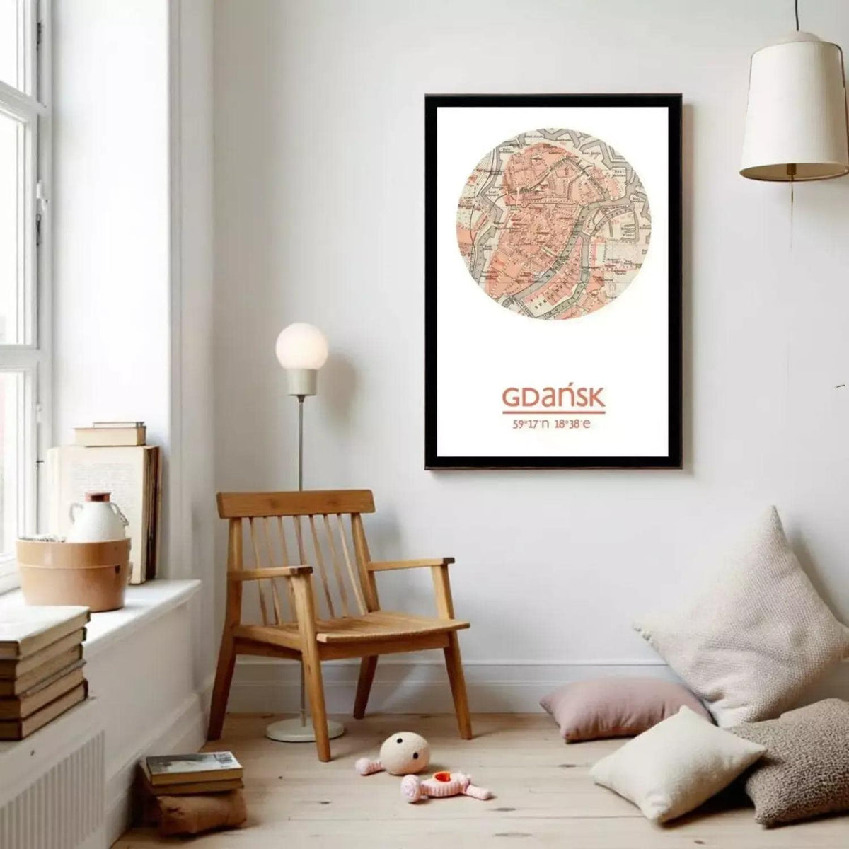 a cozy living room with a wooden chair, a lamp, and a framed map of Gdansk, Poland, hanging on the wall.