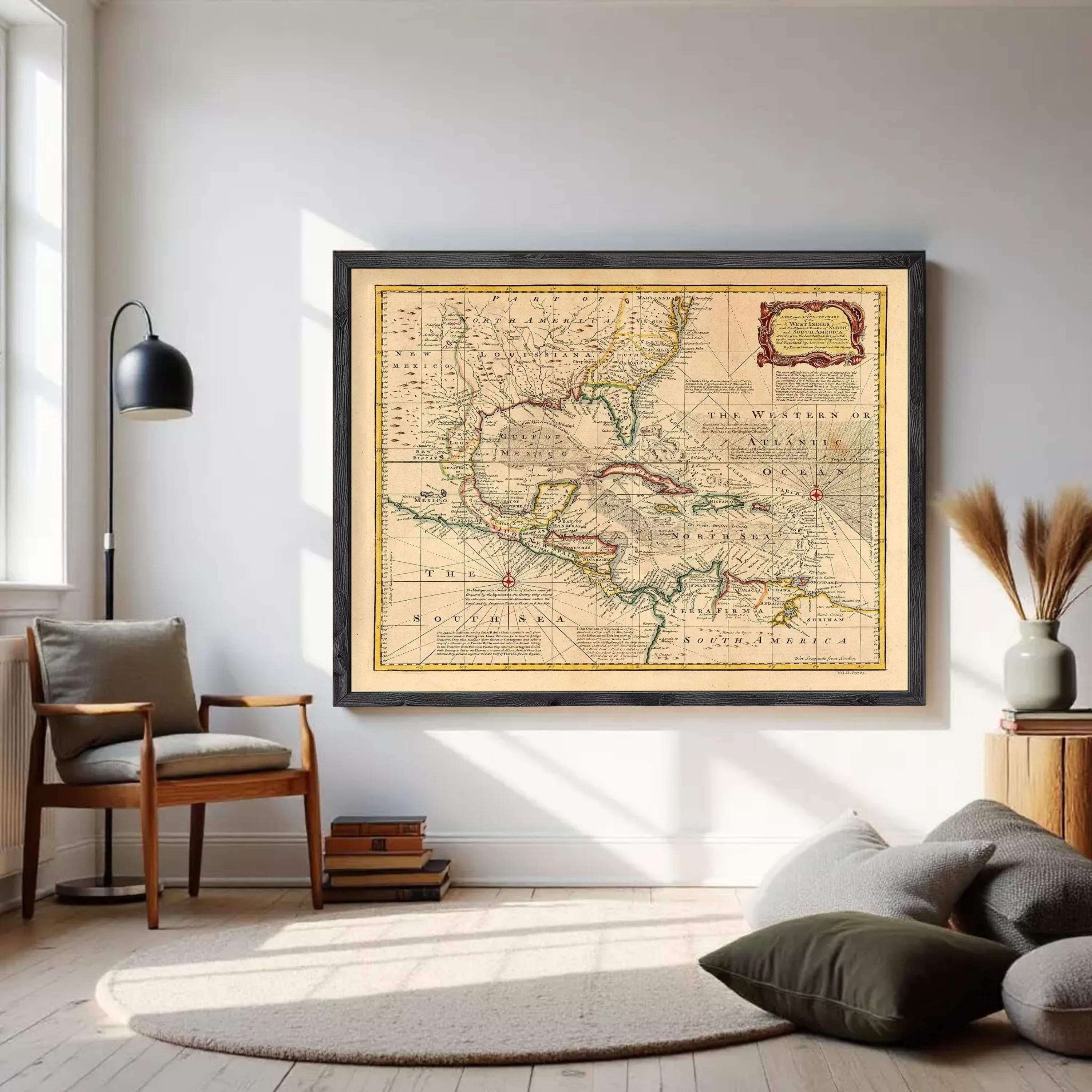 a large framed map of the Western Hemisphere hanging on a white wall in a living room.