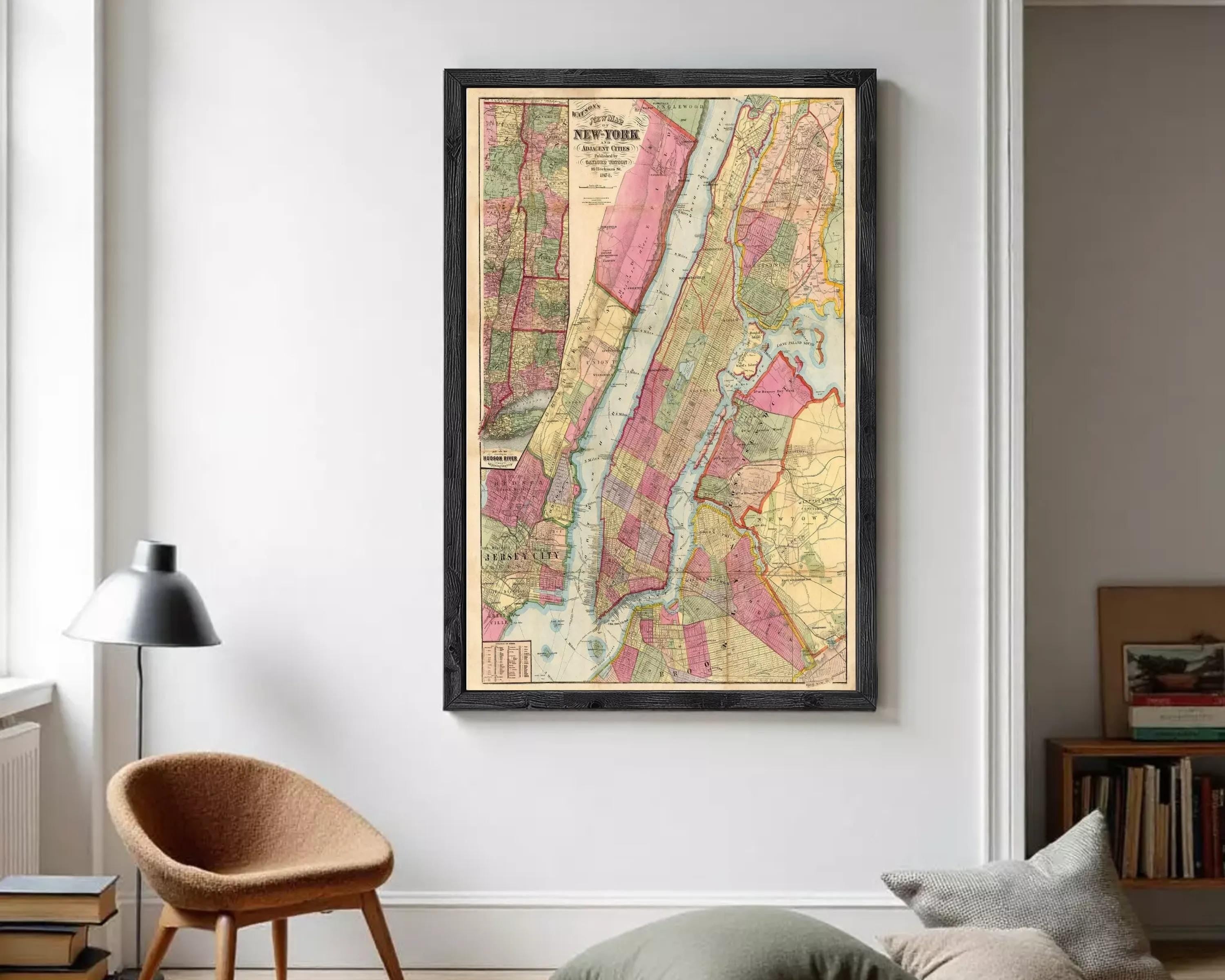 The image is a framed vintage map of New York City, depicting the city's streets, neighborhoods, and surrounding areas.
