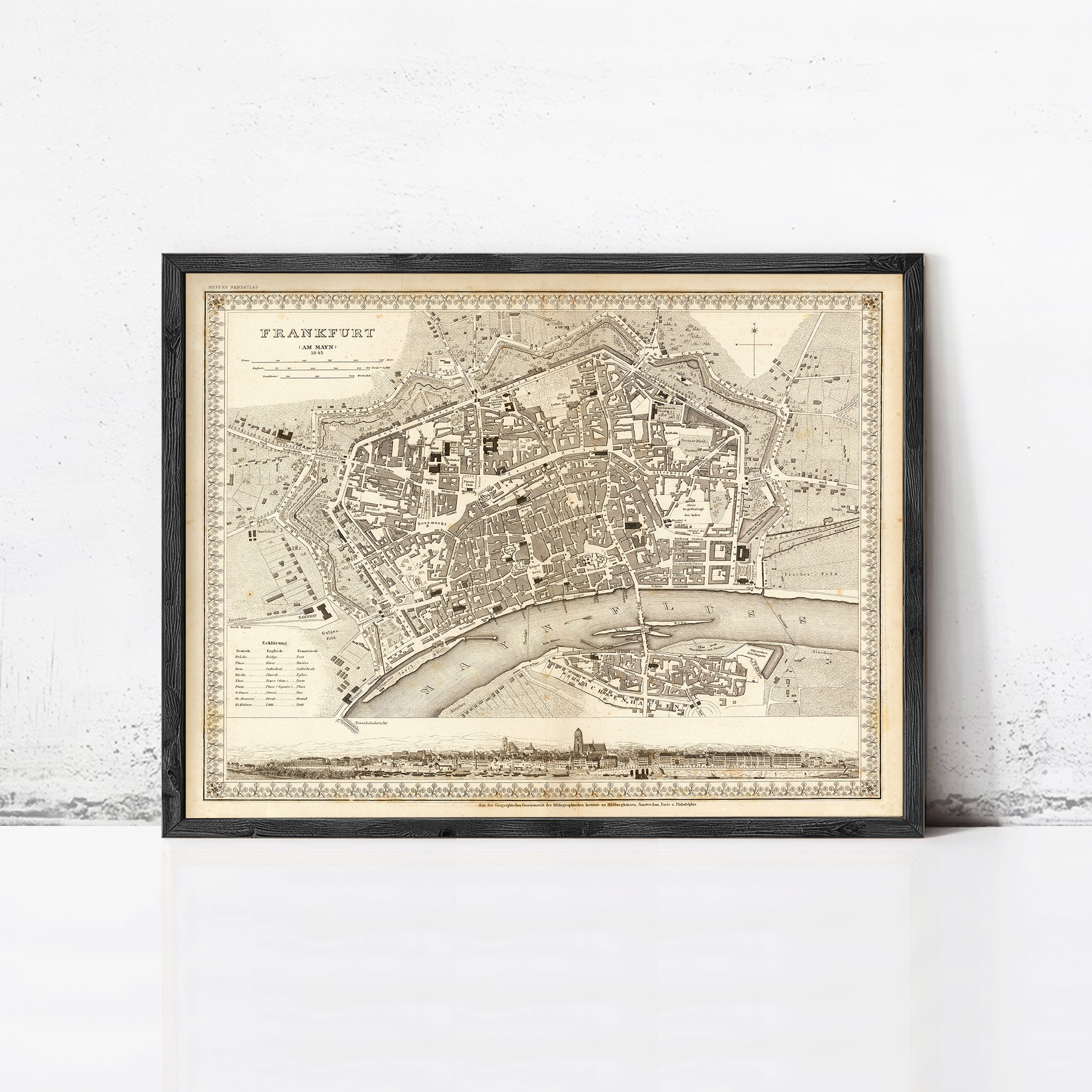 The image is a framed antique map of Frankfurt, Germany, depicting the city's layout and surrounding areas.