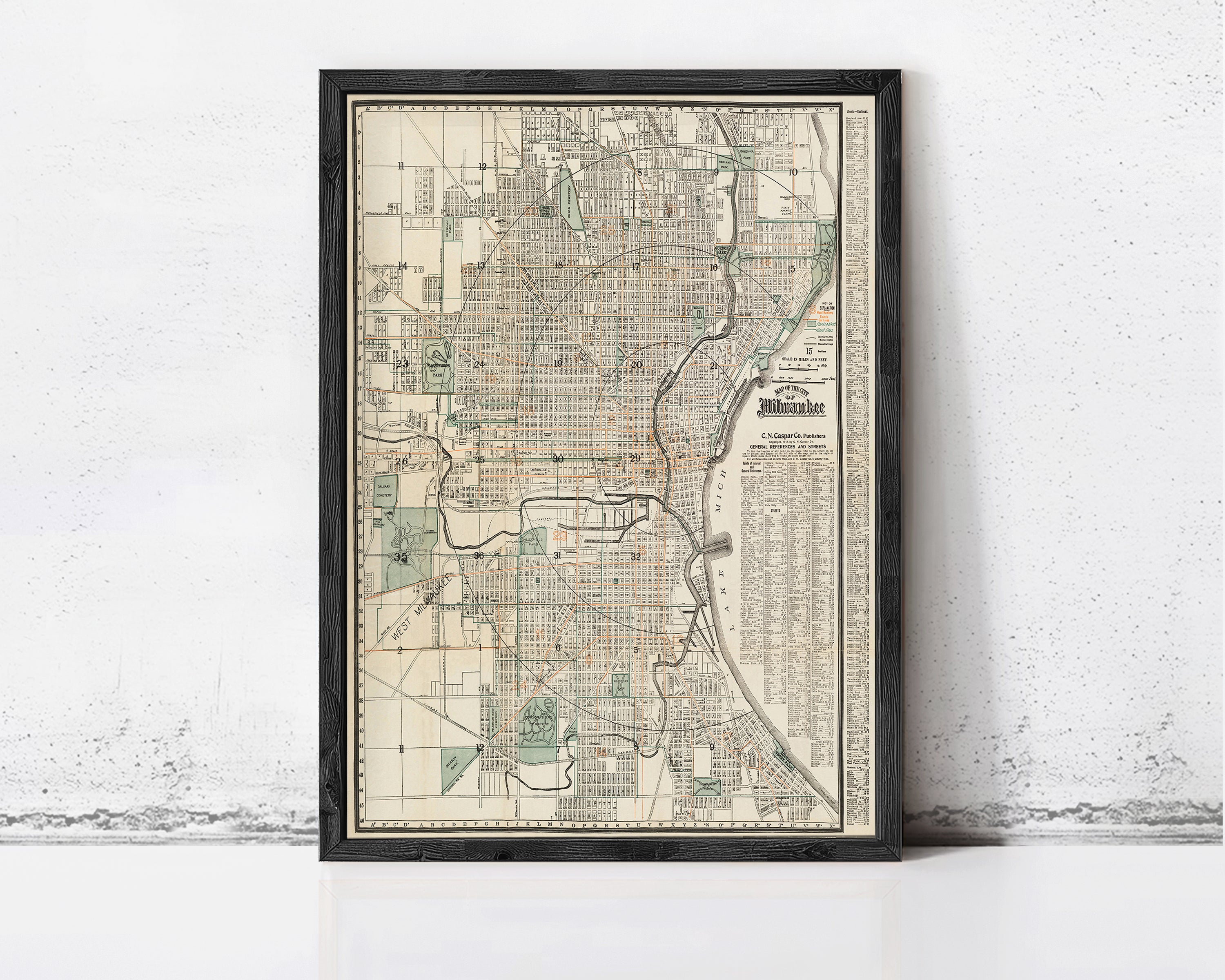 The image is a framed map of a city, likely Chicago, Illinois, with a detailed layout of streets, landmarks, and other geographic features.