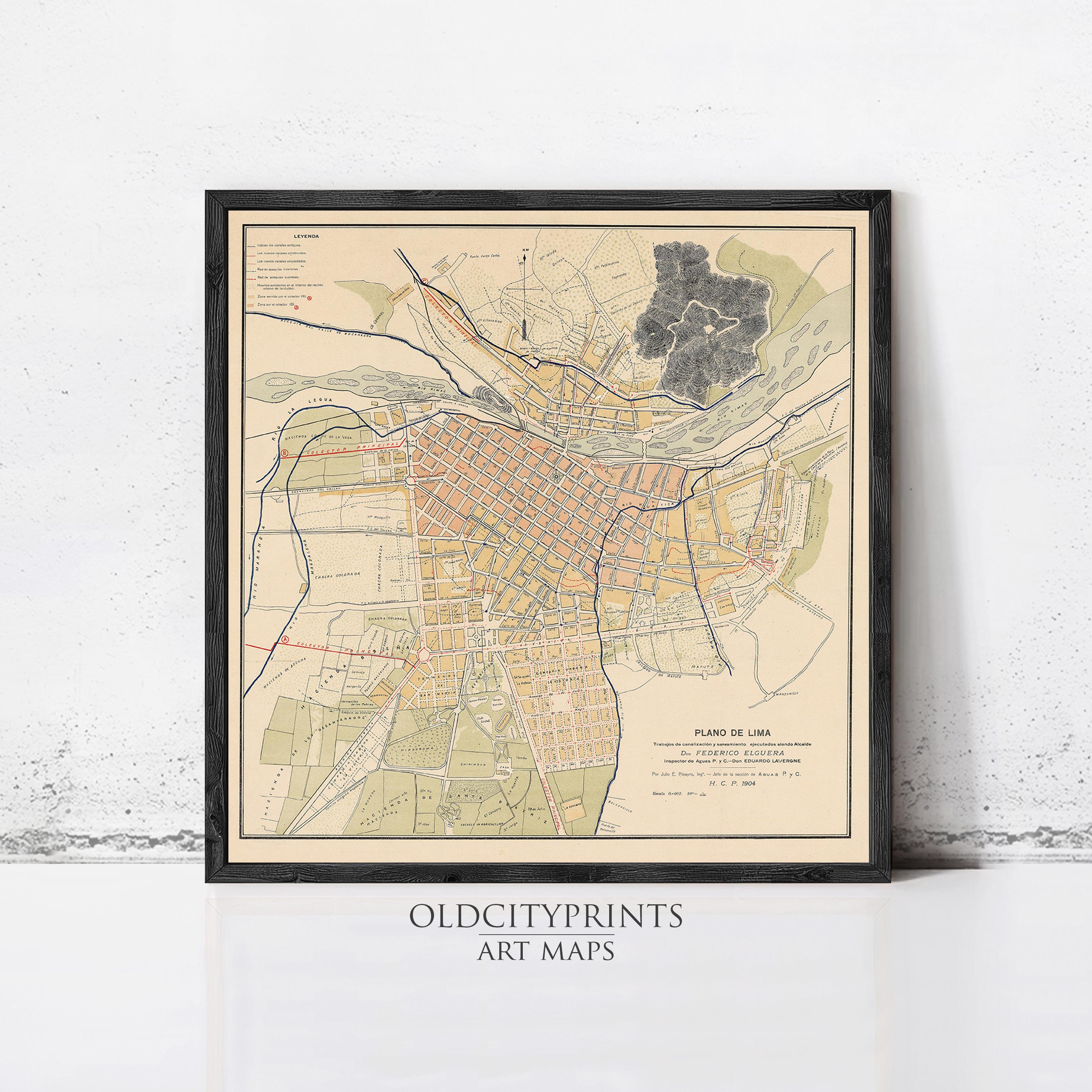 The image is a framed vintage map of a city, likely from the early 20th century, with detailed street and neighborhood maps.