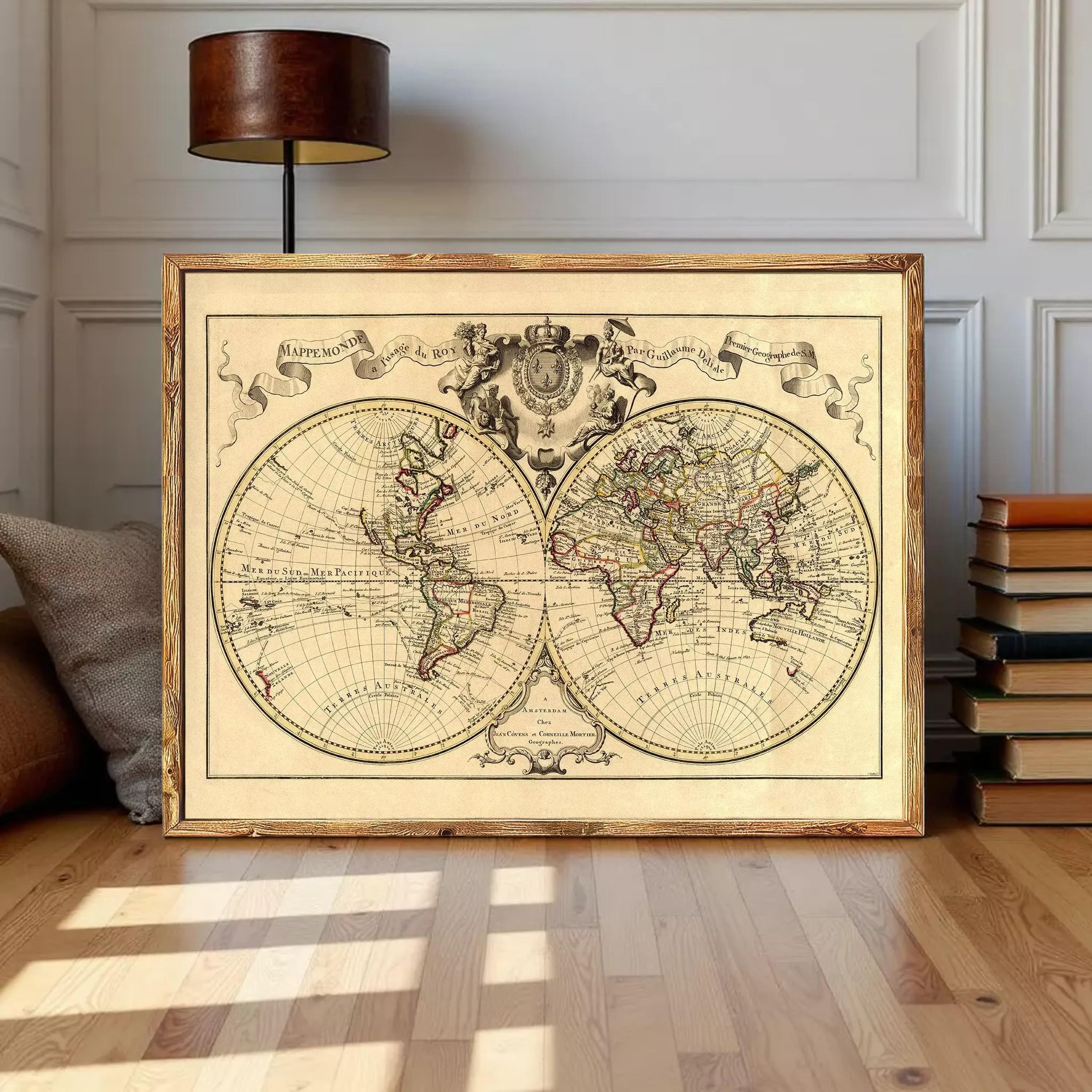 The image is a framed antique world map depicting the continents and oceans of the known world.