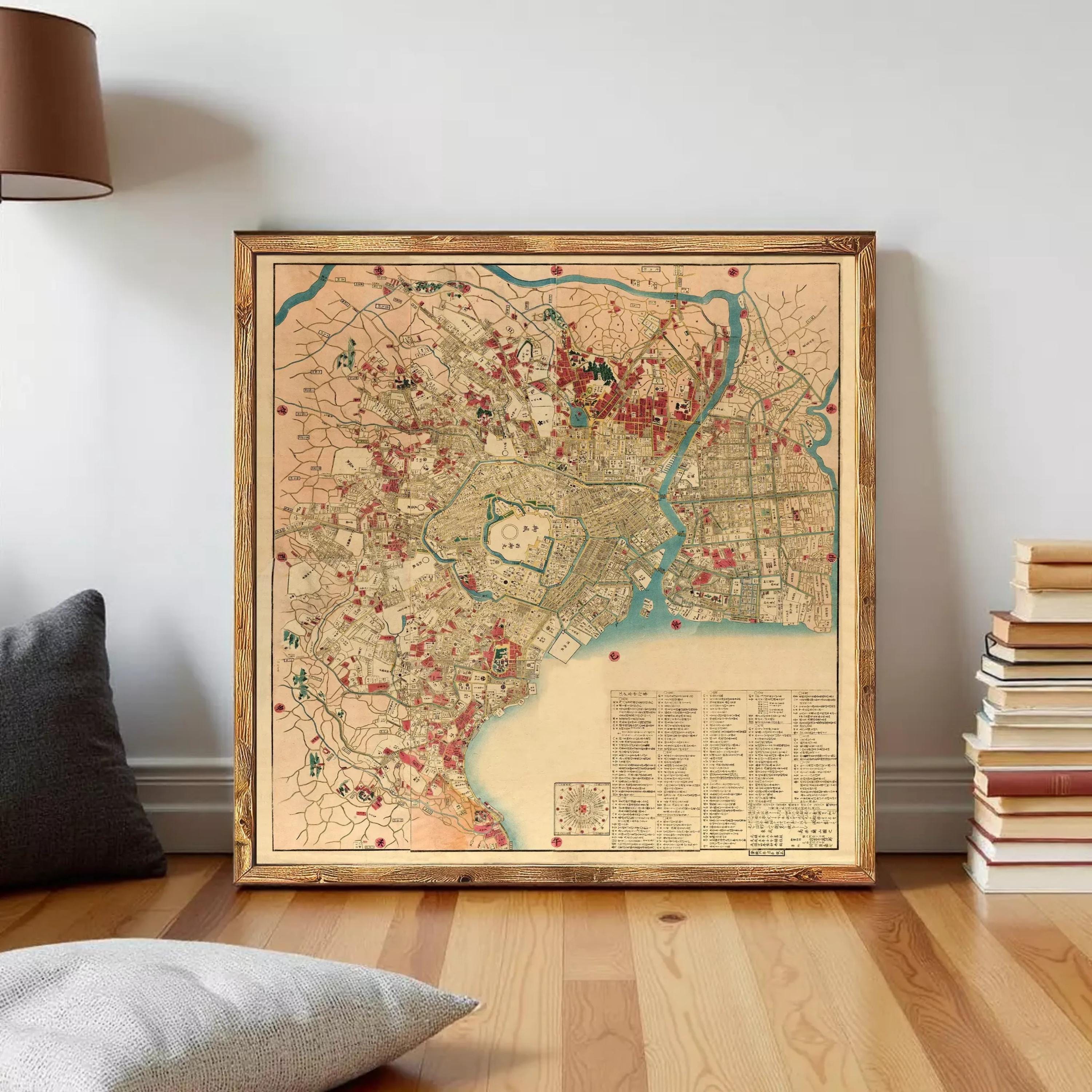 The image is a framed vintage map of a city, likely from the 19th century, with various landmarks and streets depicted in a detailed and colorful manner.