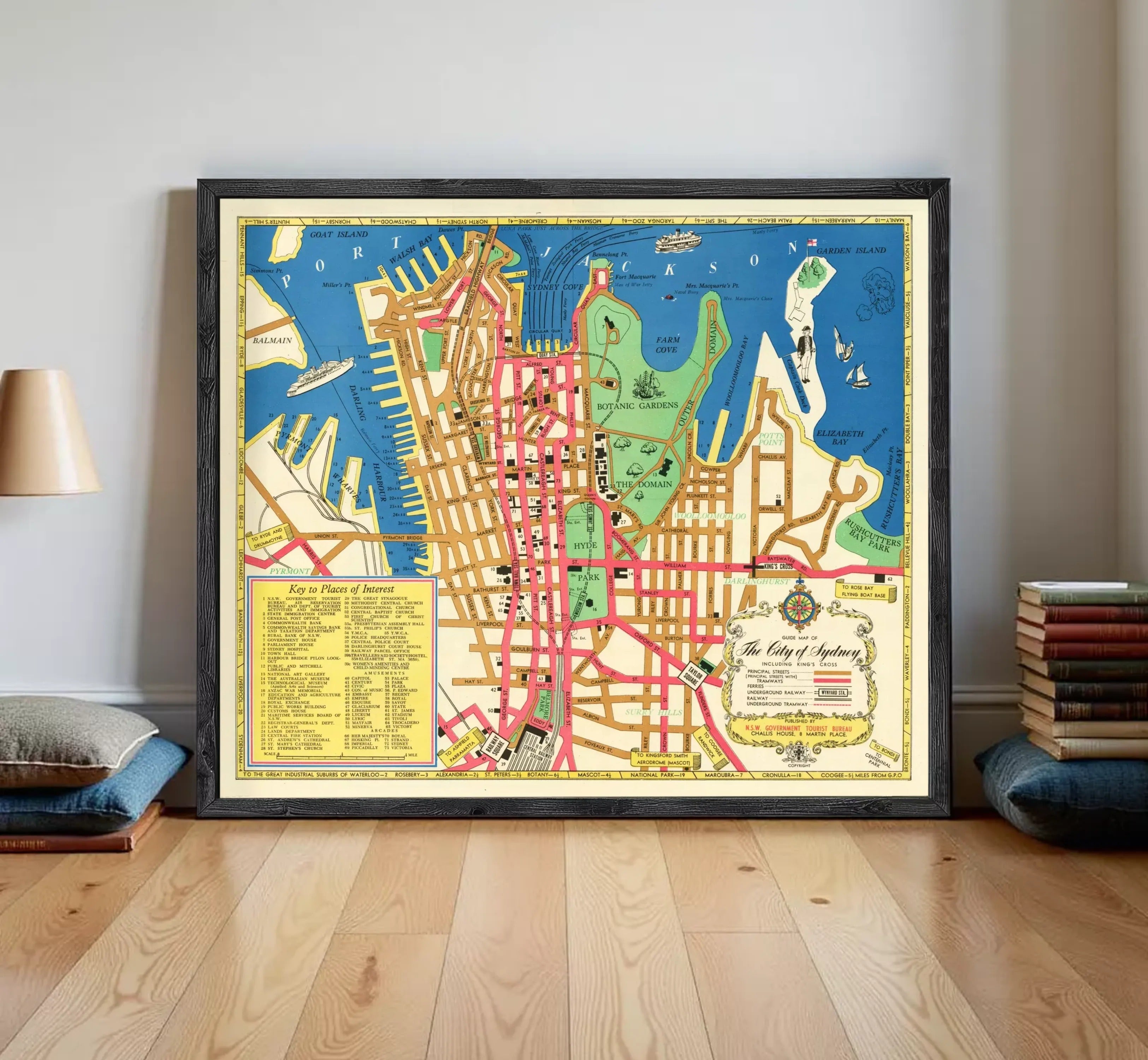The image is a framed vintage map of a city, likely Sydney, Australia, with various landmarks and streets labeled.