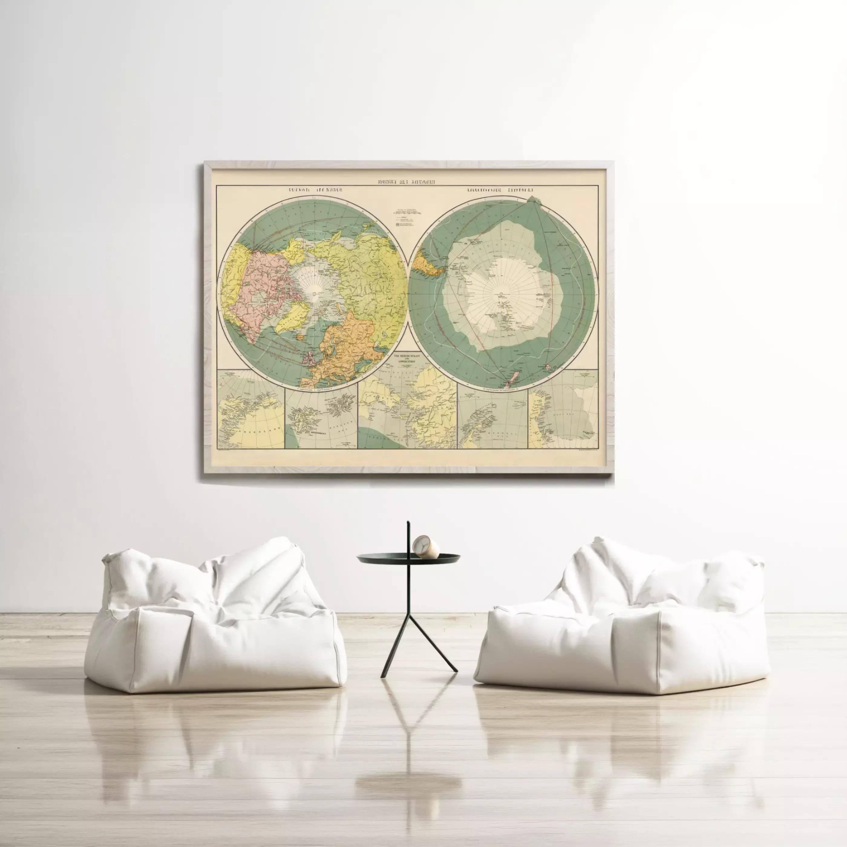 a large vintage map of the world hanging on a white wall, with two white bean bag chairs positioned in front of it.