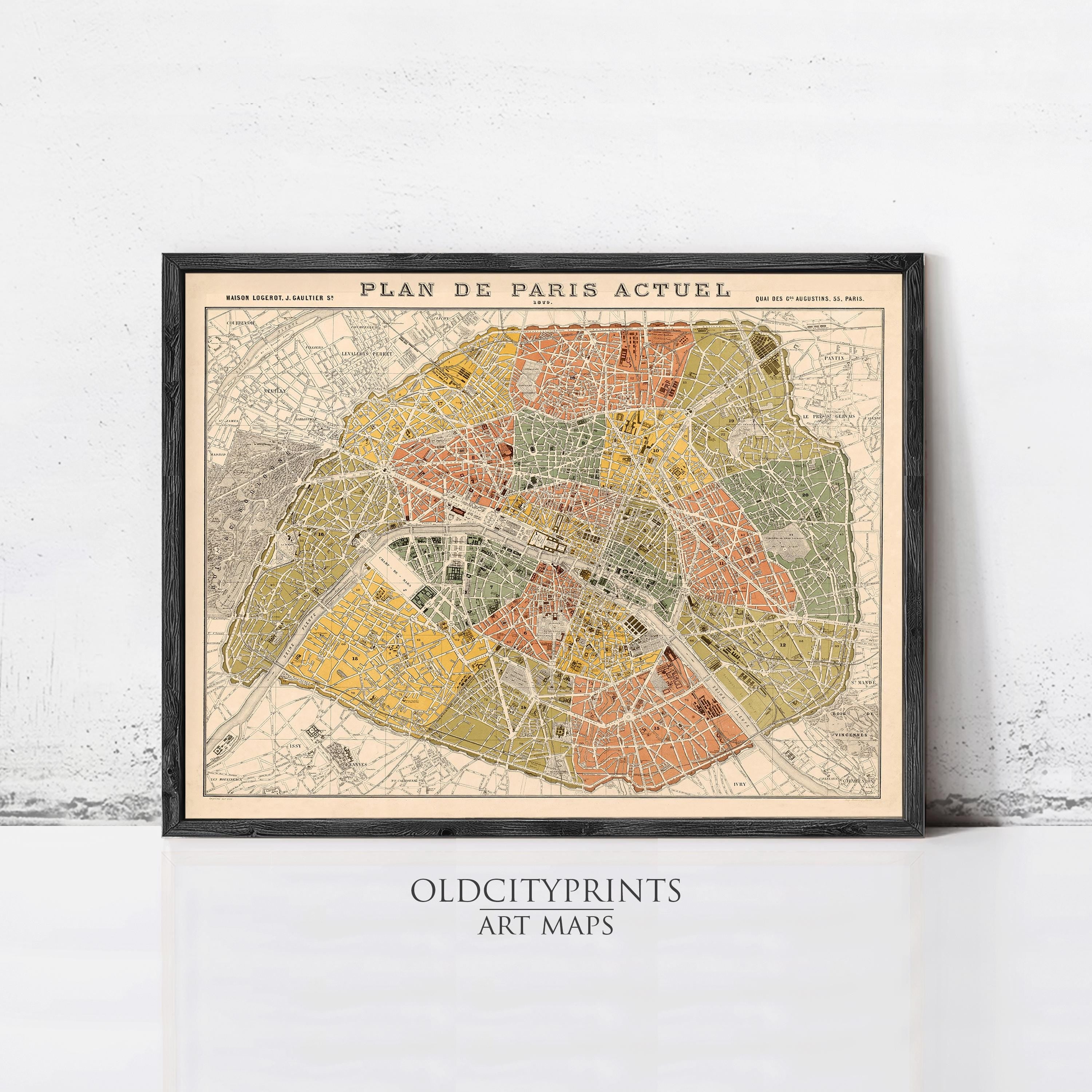 The image is a framed vintage map of Paris, France, depicting the city's streets and neighborhoods in a detailed and colorful manner.