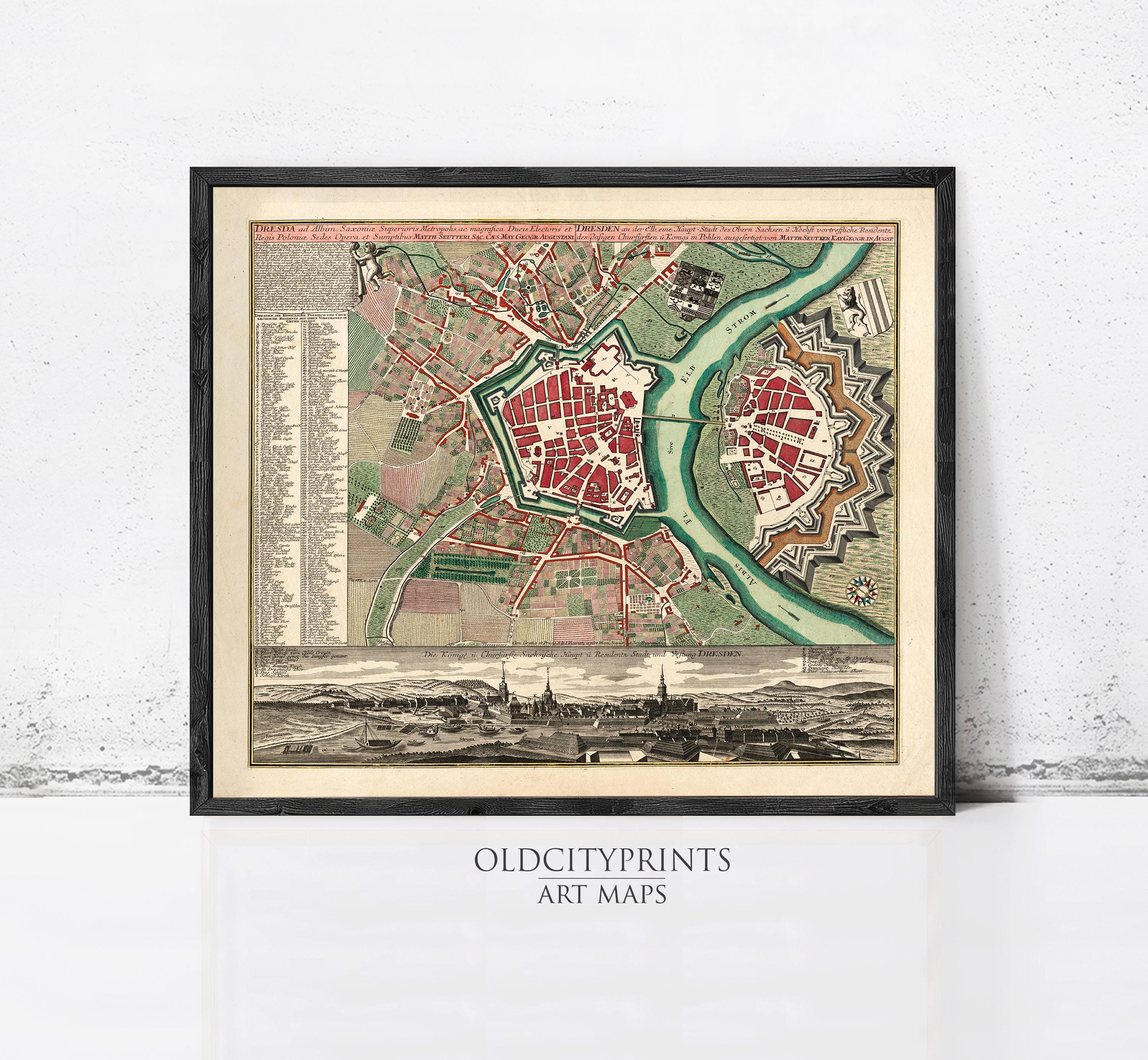 The image is a framed vintage map of a city, depicting the layout of the city with streets, buildings, and other landmarks.