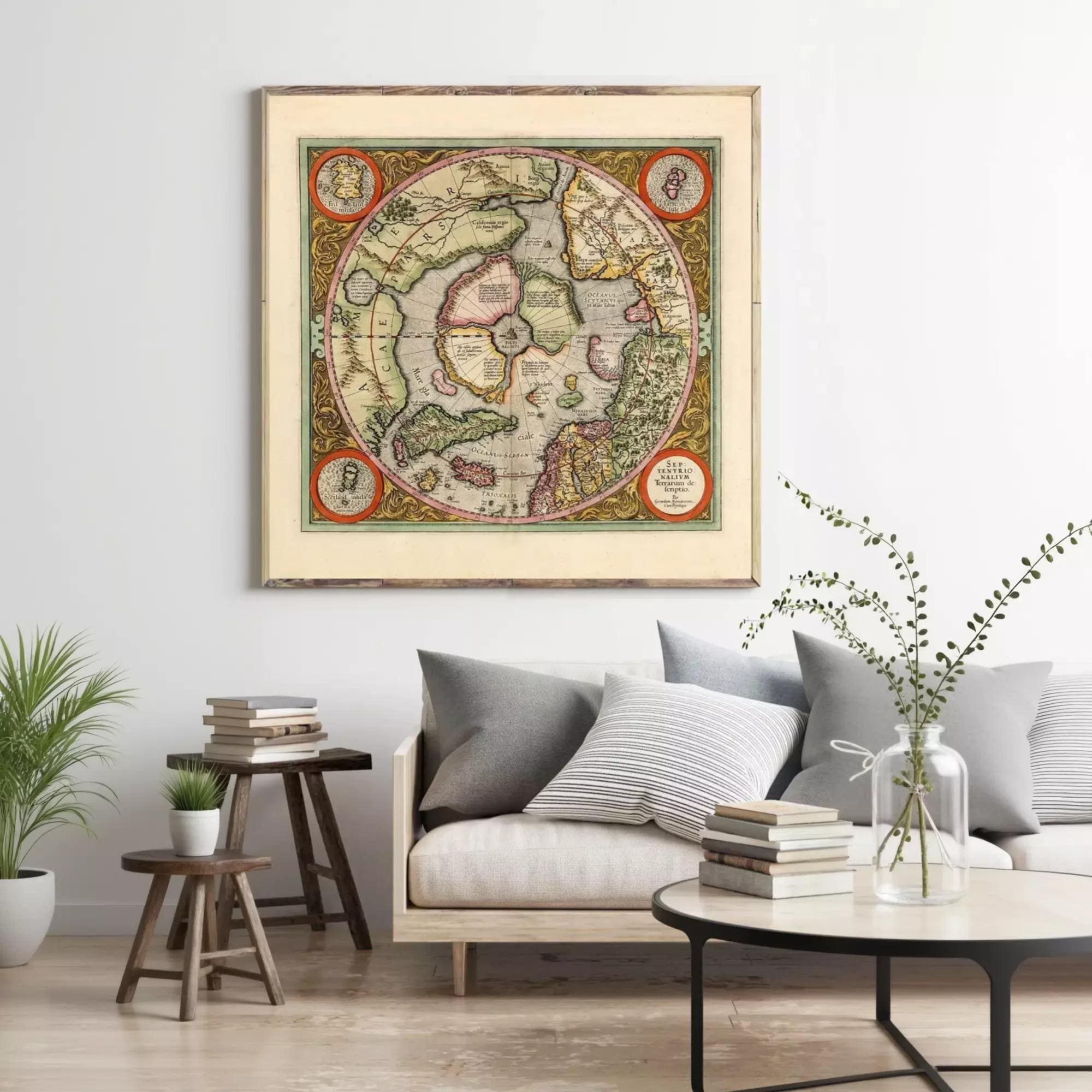 a large framed map of the world hanging on a wall in a living room setting.