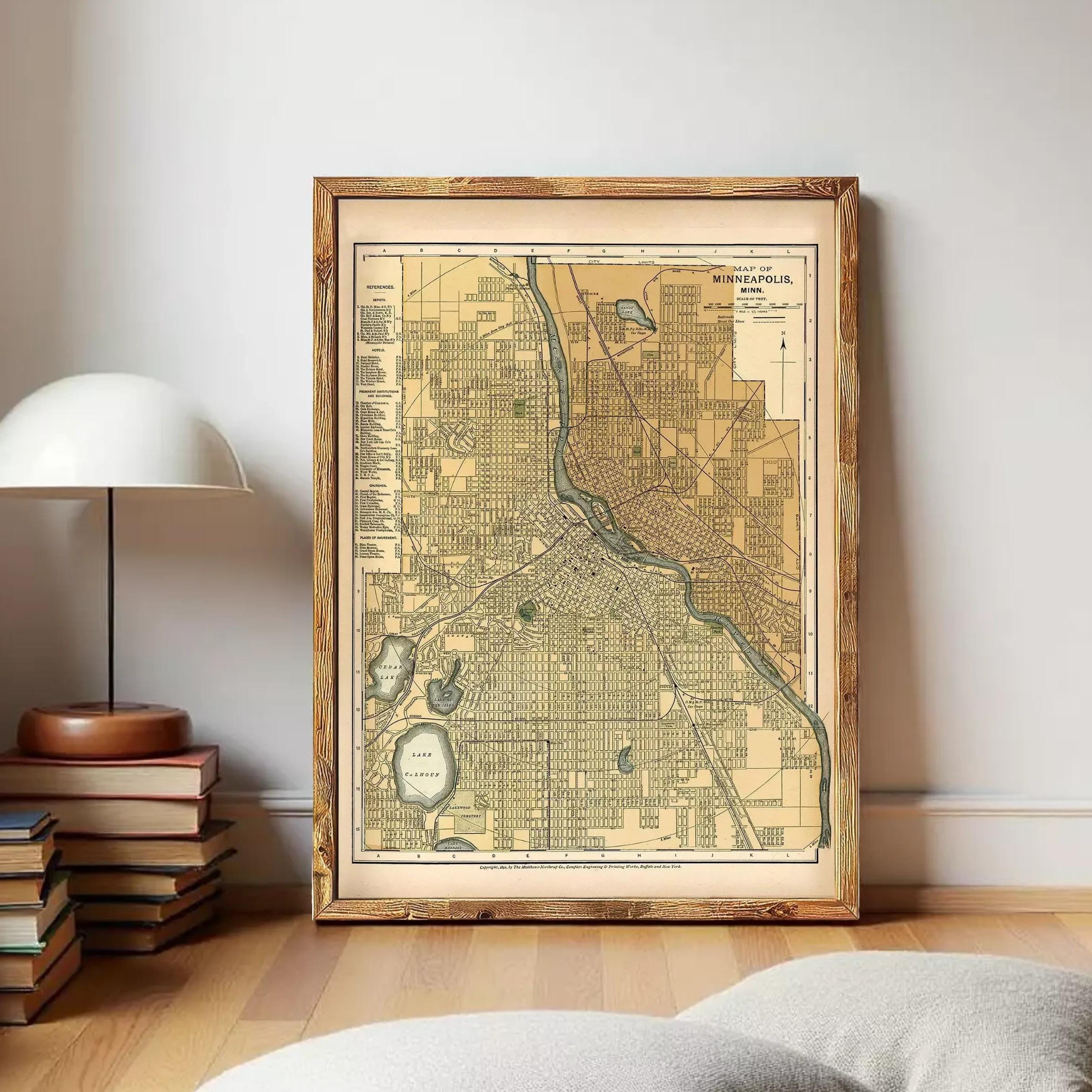 The image is a framed map of Minneapolis, Minnesota, with a wooden frame.