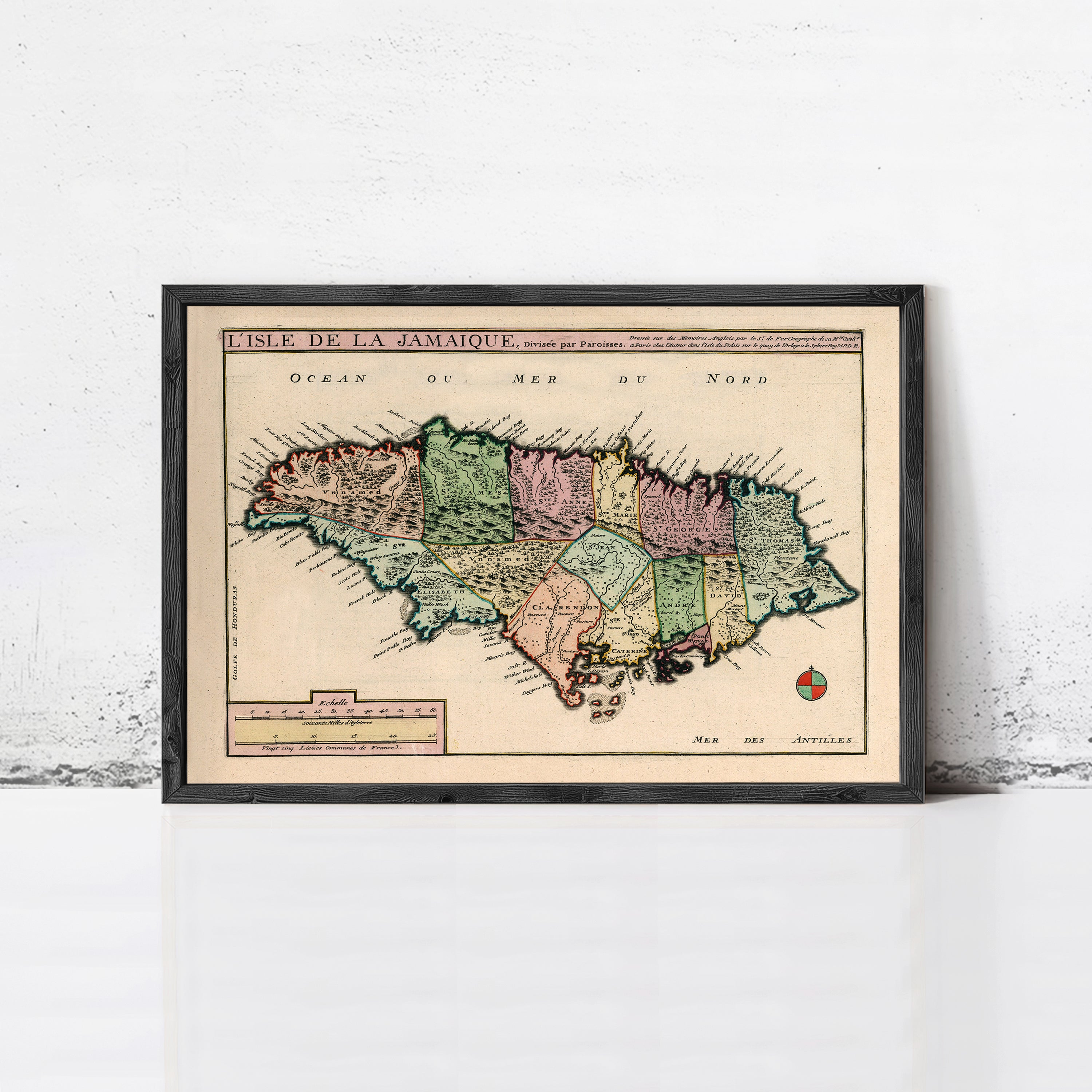 The image is a framed vintage map of Jamaica, depicting the island's geographical layout and surrounding areas.